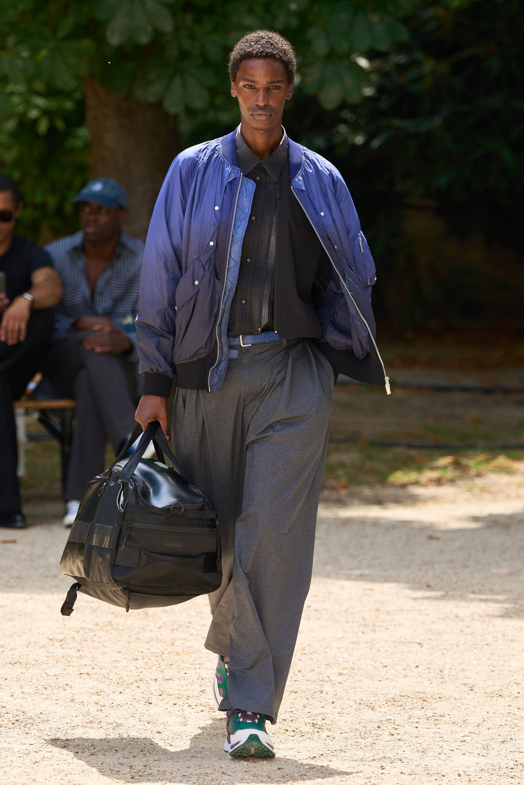 blue relaxed jacket black shirt gray pants