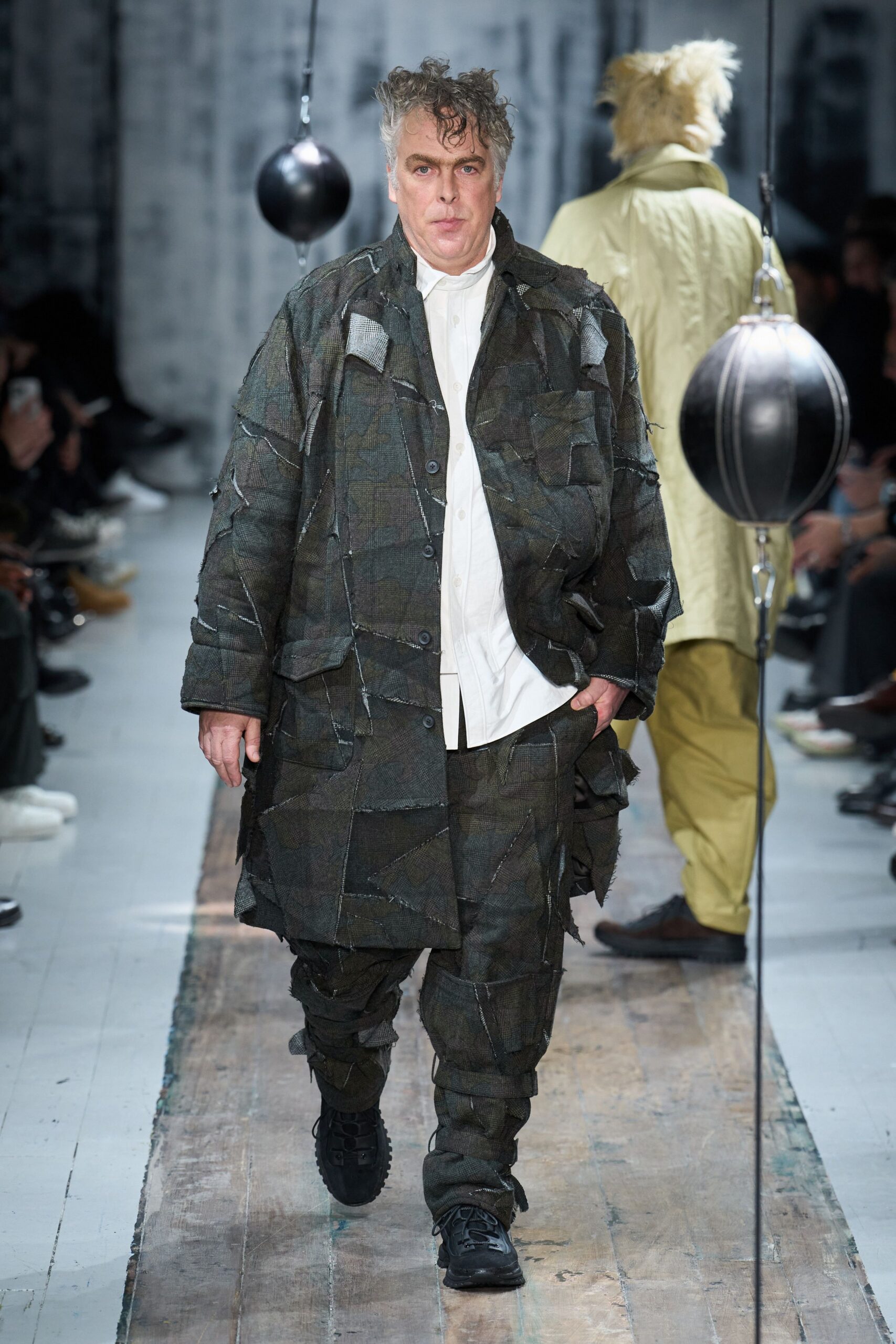 green layered coat with cargo pants