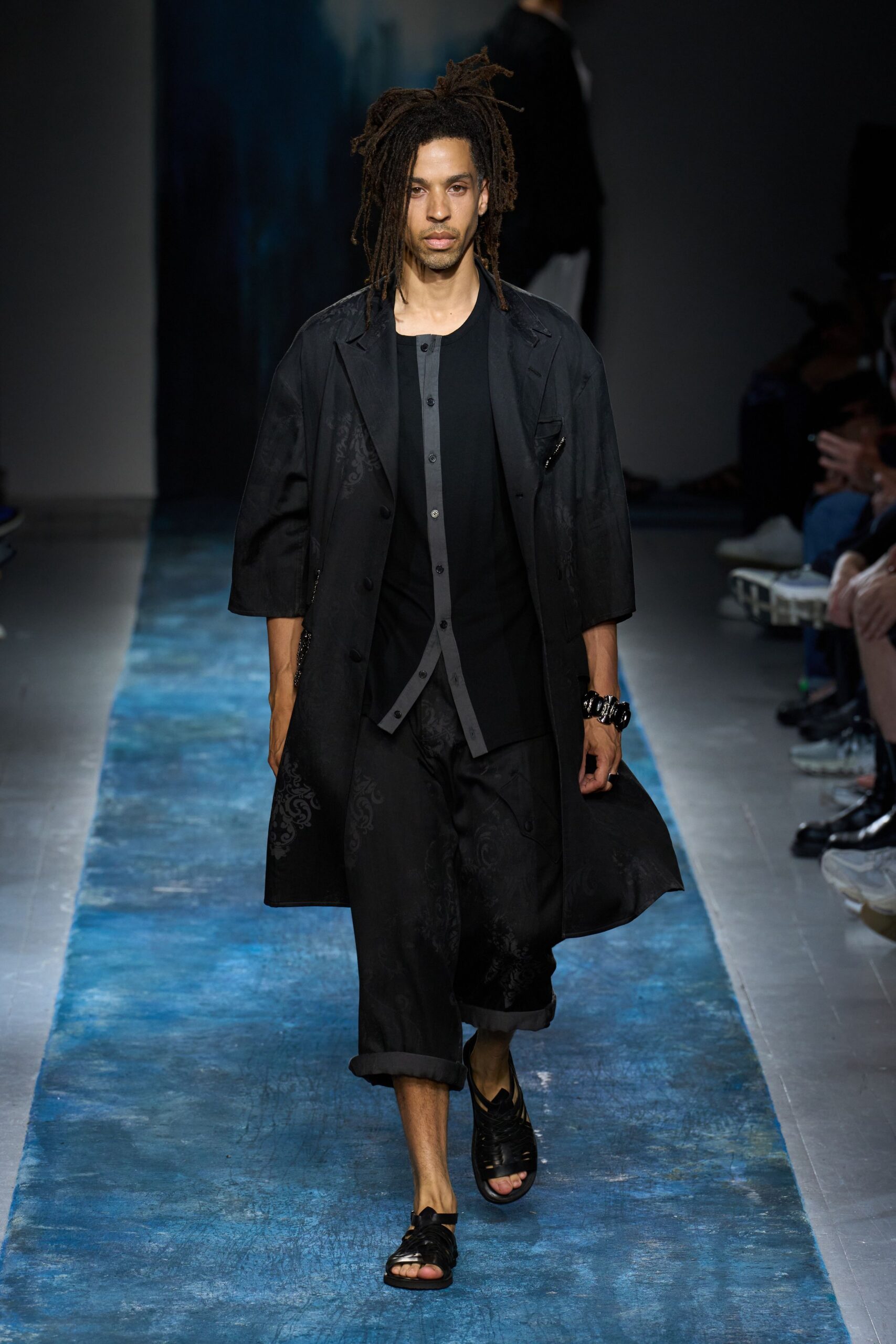 black relaxed coat with t-shirt and pants