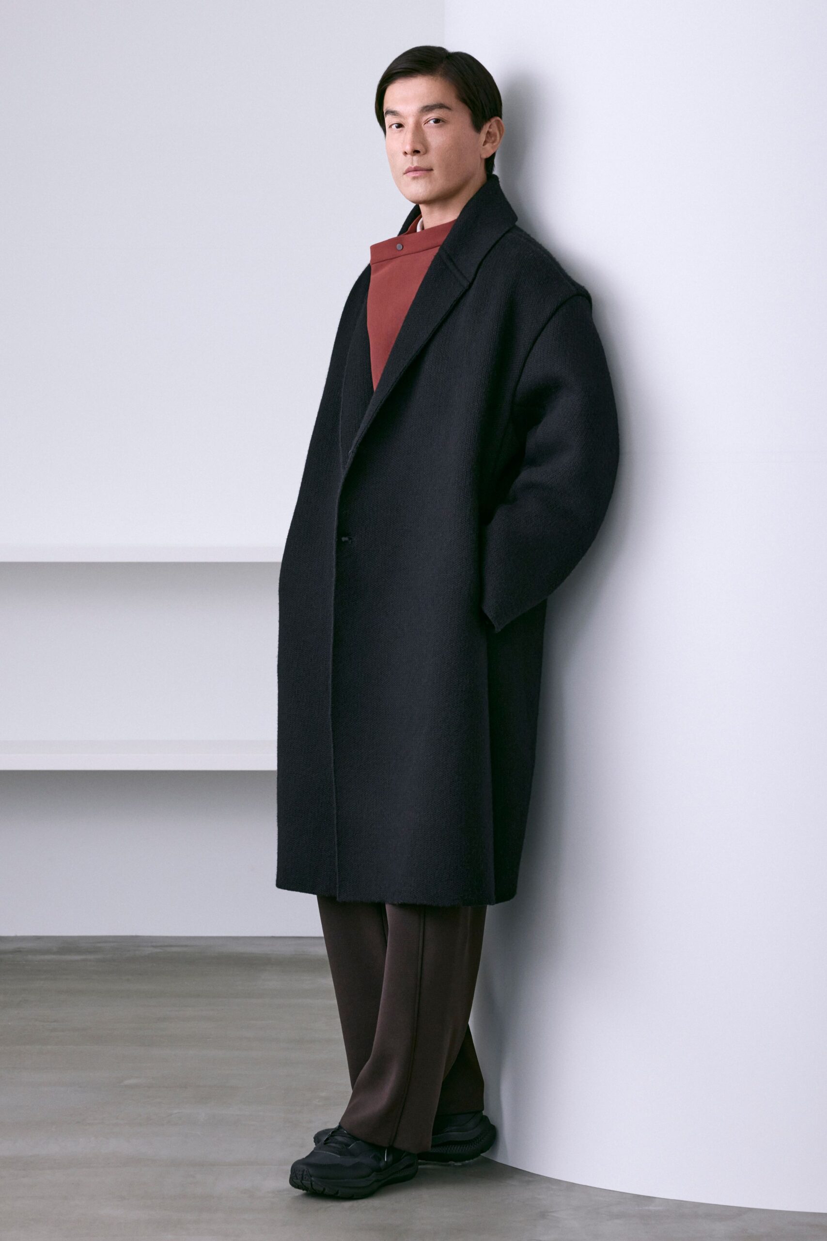 black wool coat with red top