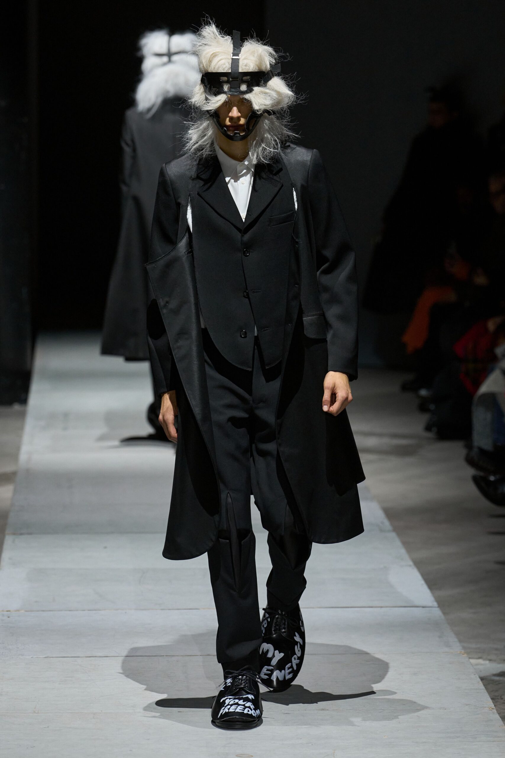 black wool coat and tailored pants