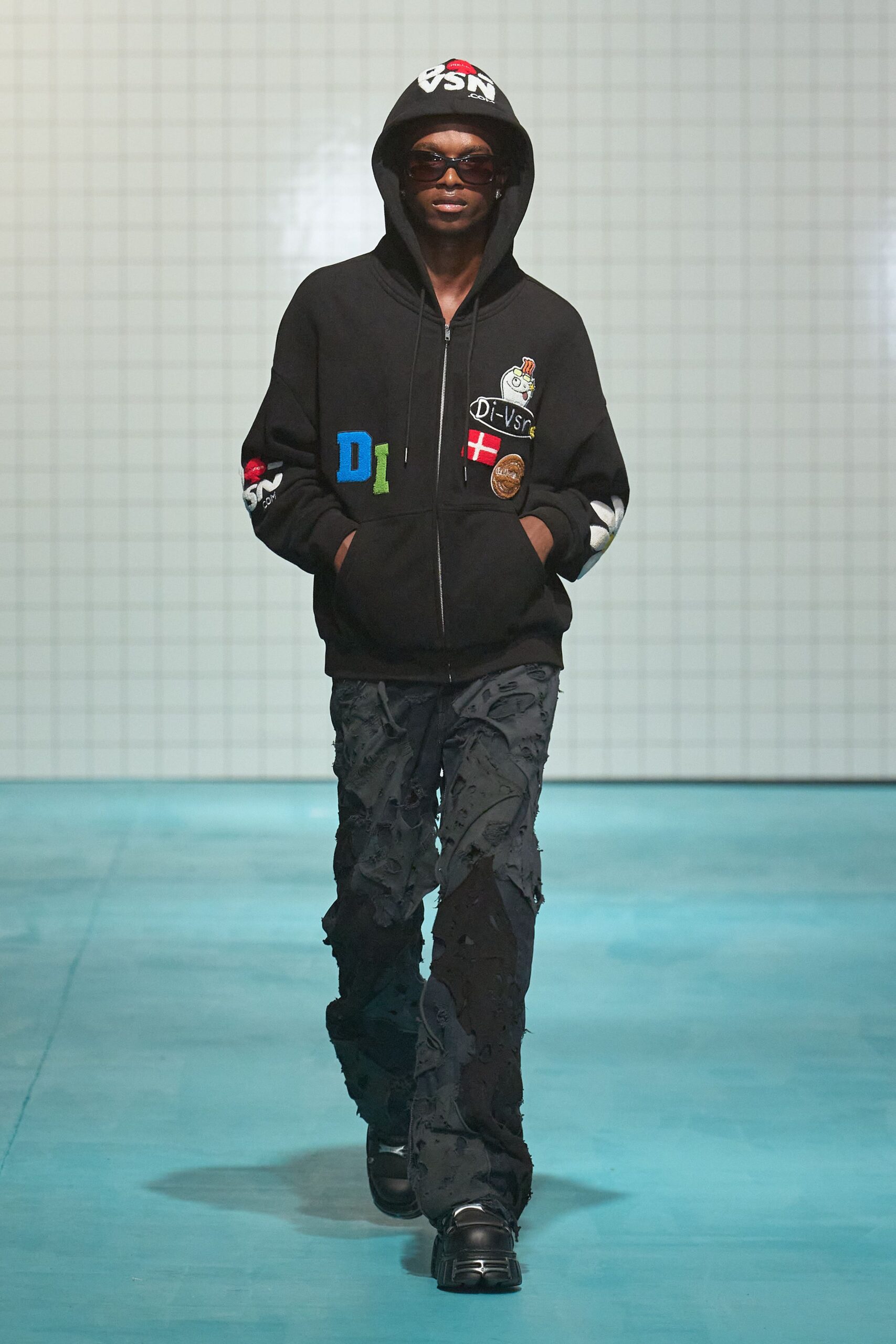 black hoodie with distressed pants