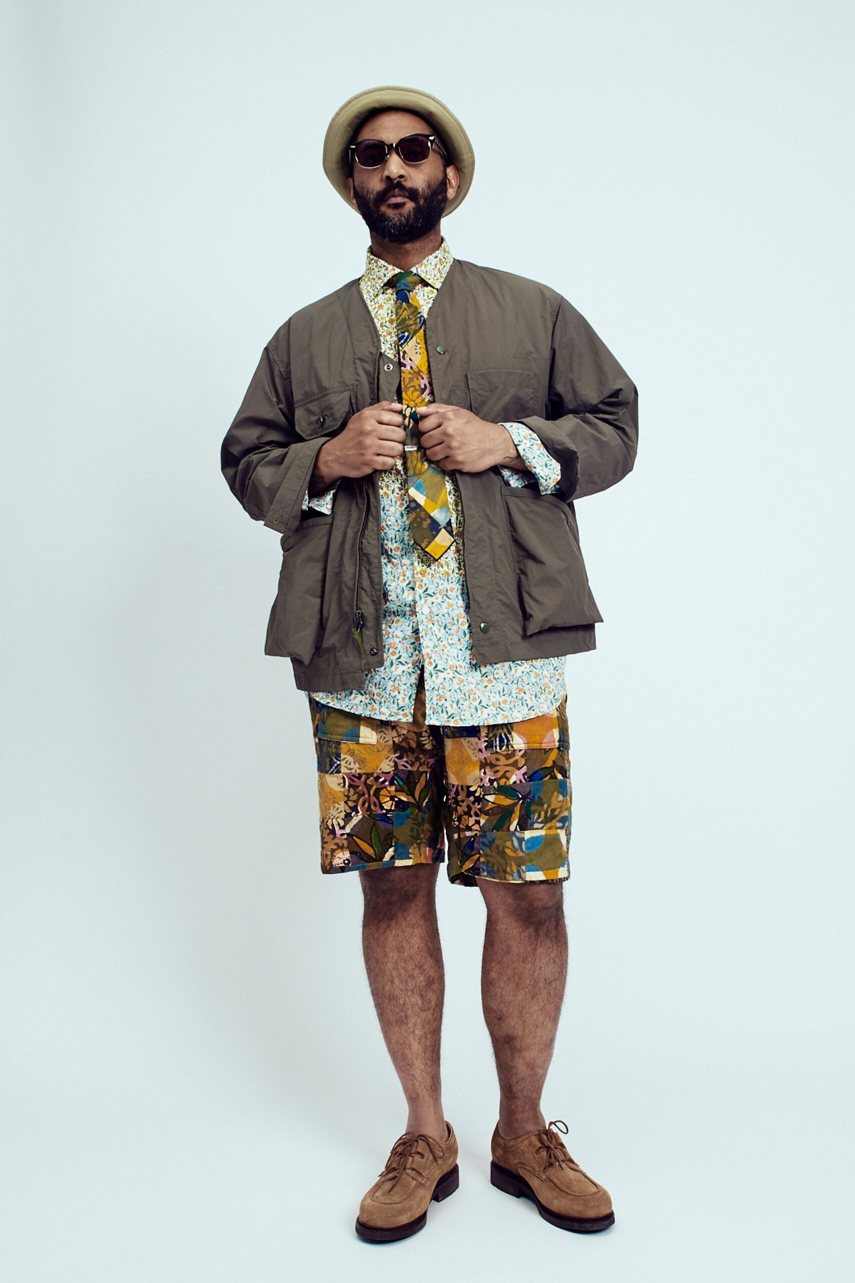 relaxed green jacket with floral shirt