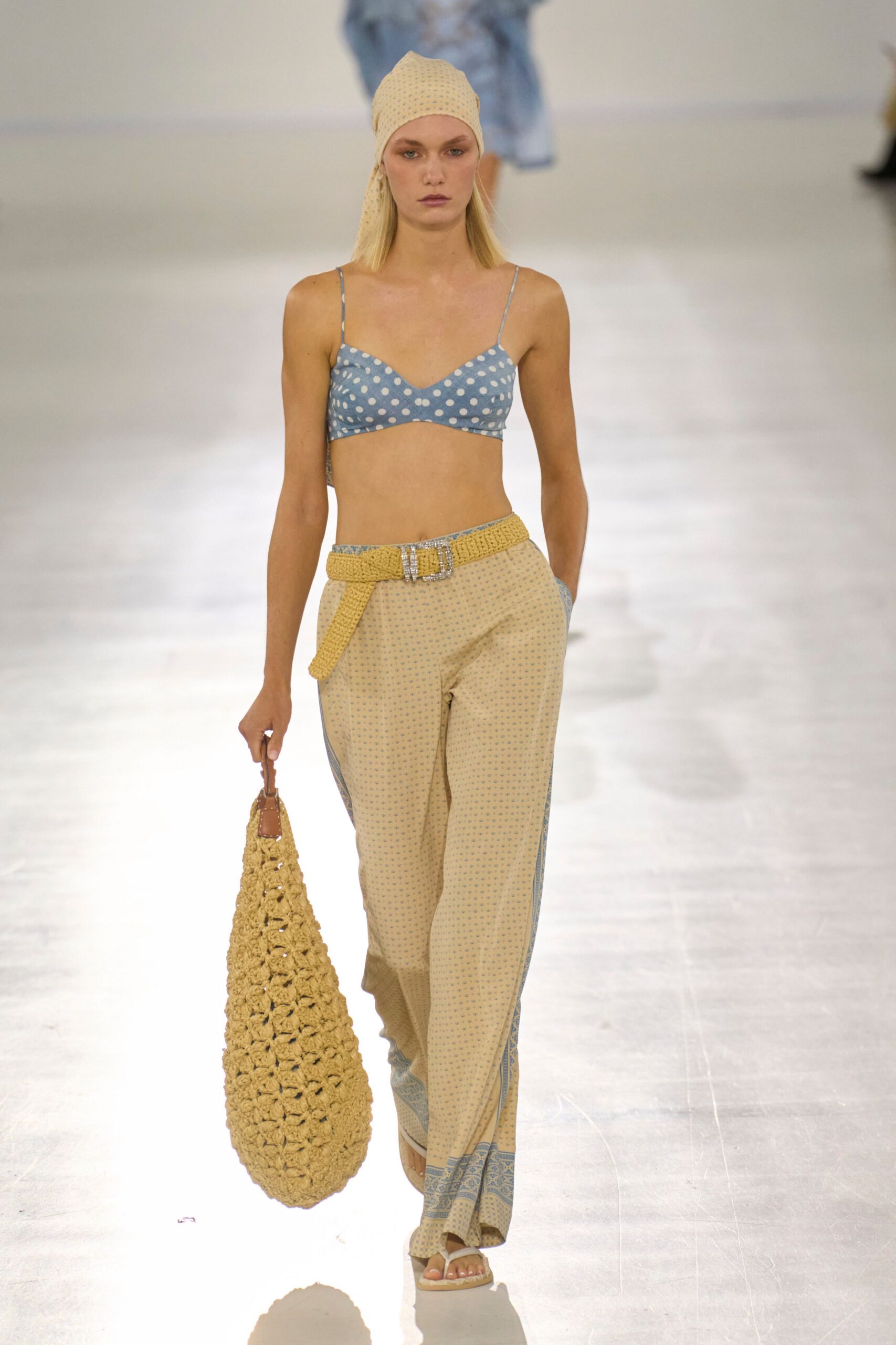 blue polka-dot top with beige pants