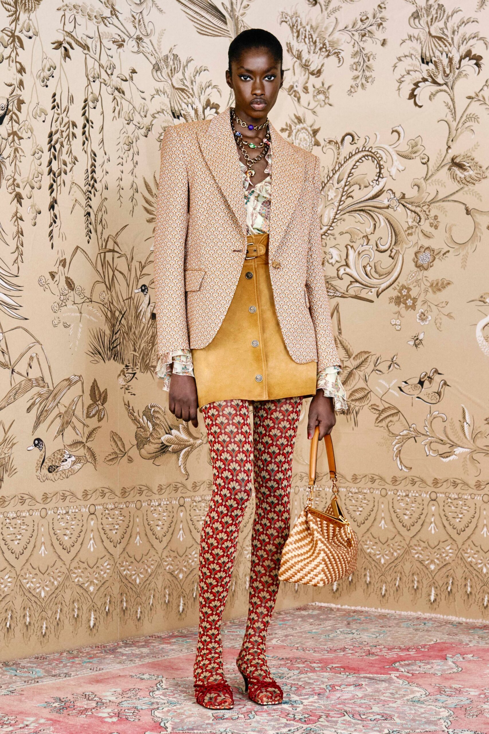 beige printed blazer with tan skirt
