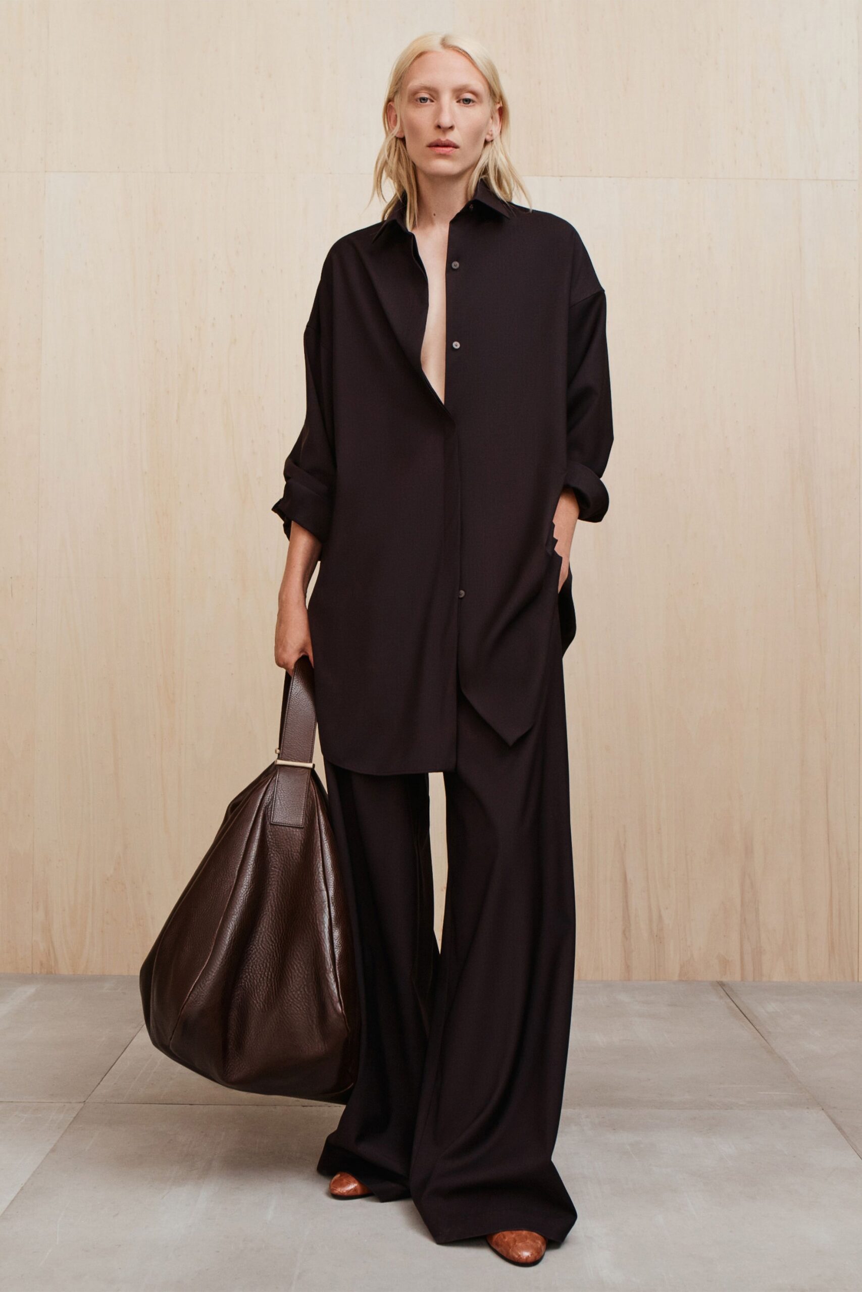 black oversized shirt with relaxed pants