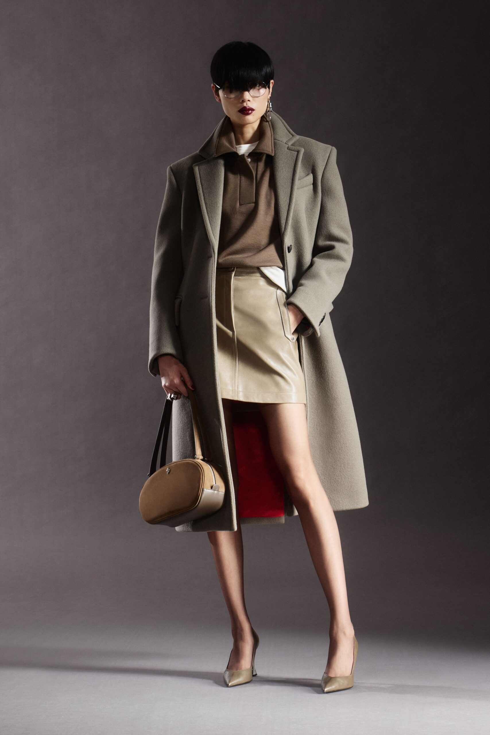 gray wool coat with beige leather skirt