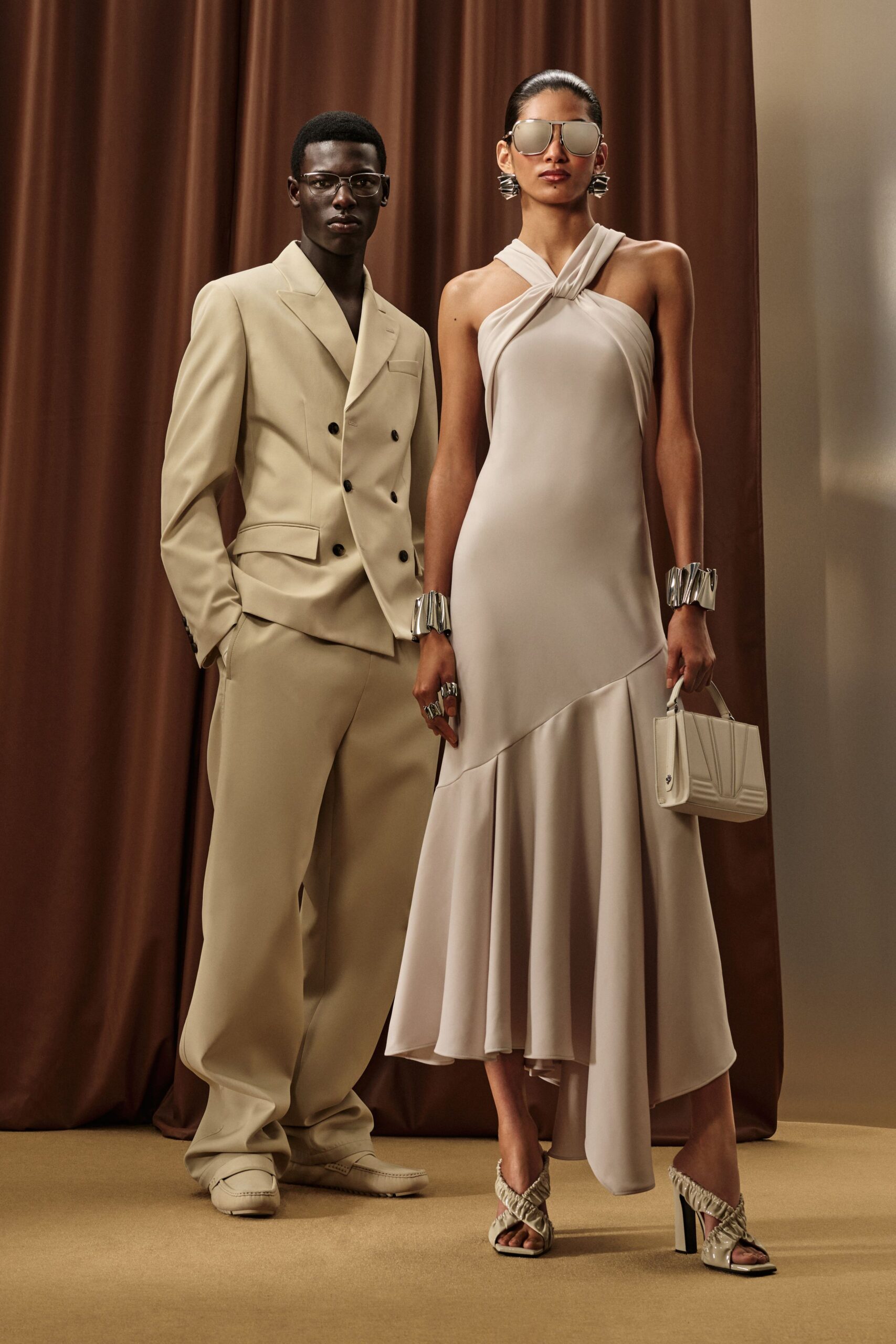 beige silk sleeveless v-neck fitted draped flowing gown
