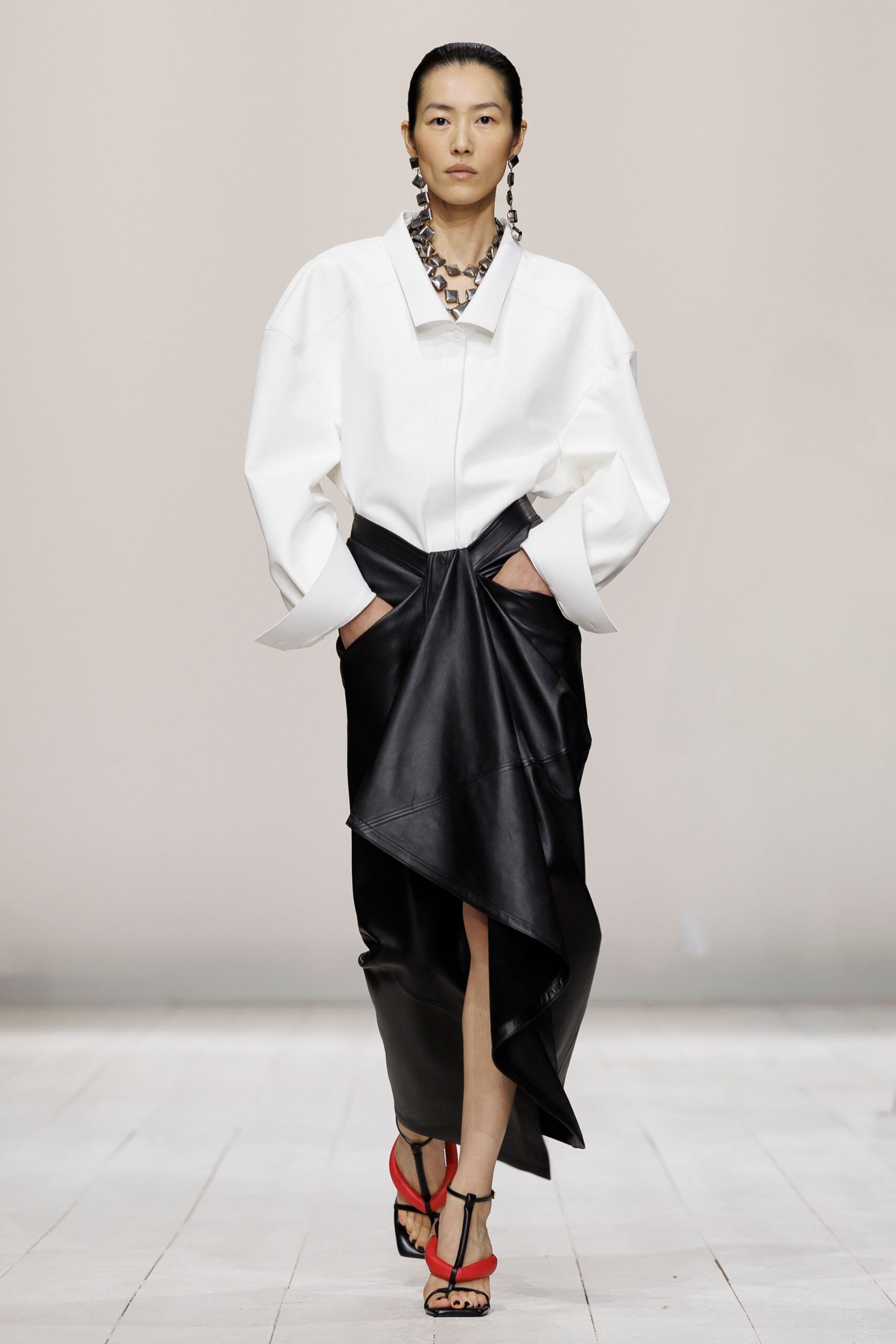 black leather asymmetric slit fitted draped skirt