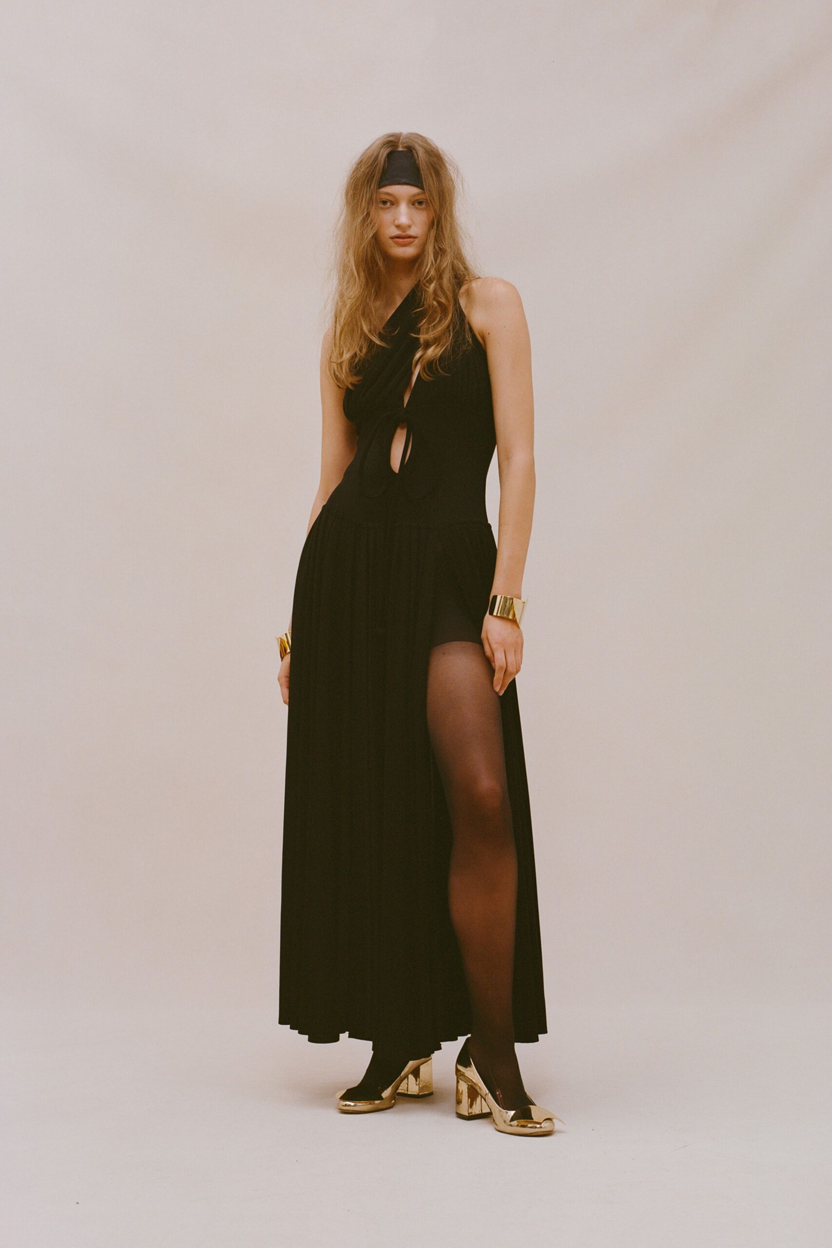 black gown with gold shoes