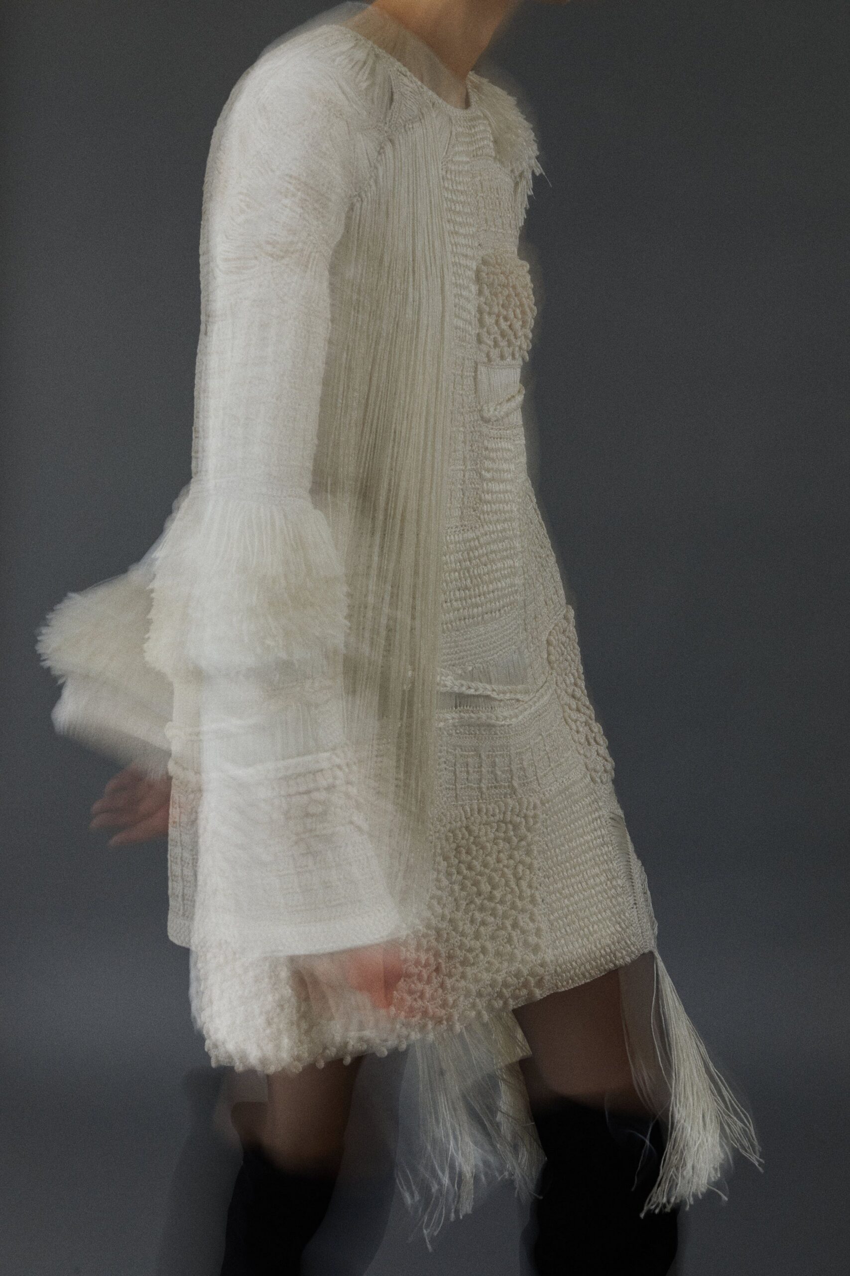 white silk long-sleeve fitted pleated fringed flowing dress