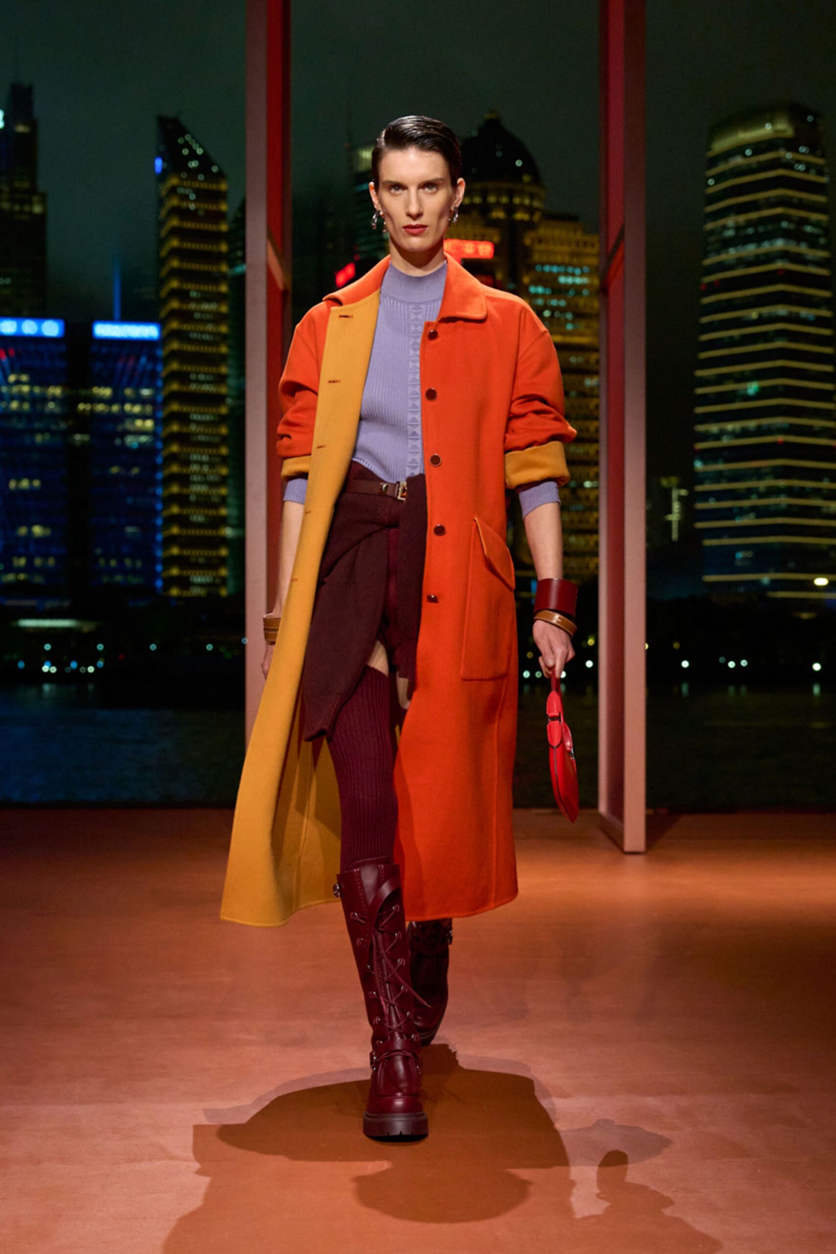 orange and yellow coat with purple top