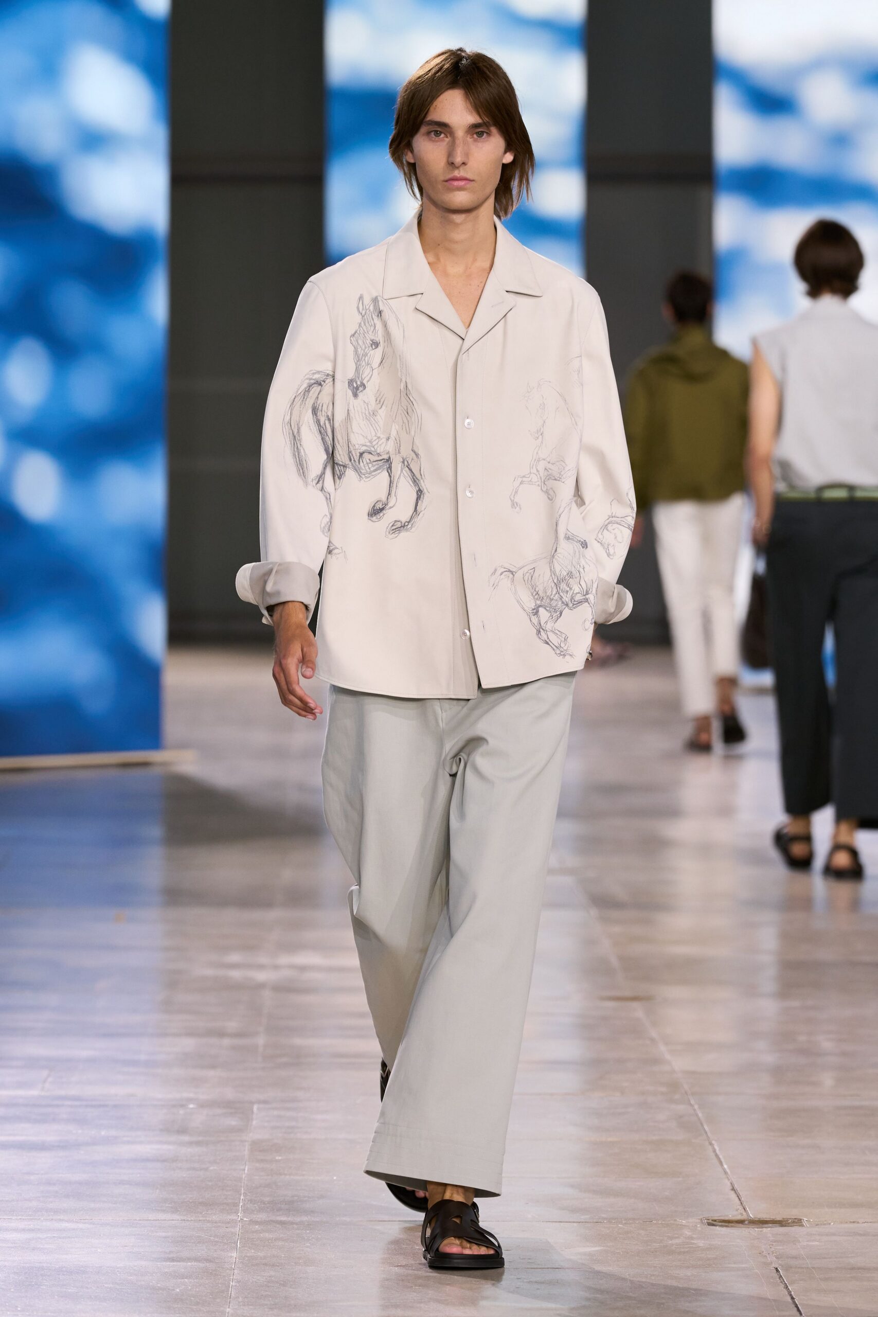 white relaxed shirt gray pants