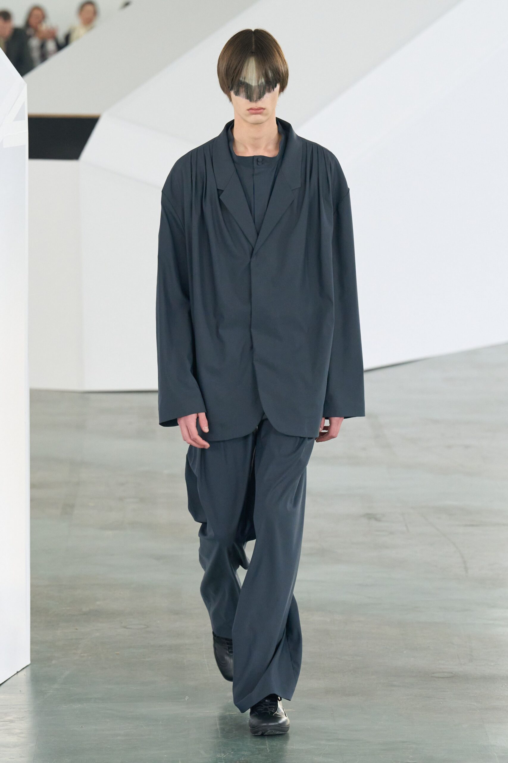 gray relaxed suit with sunglasses