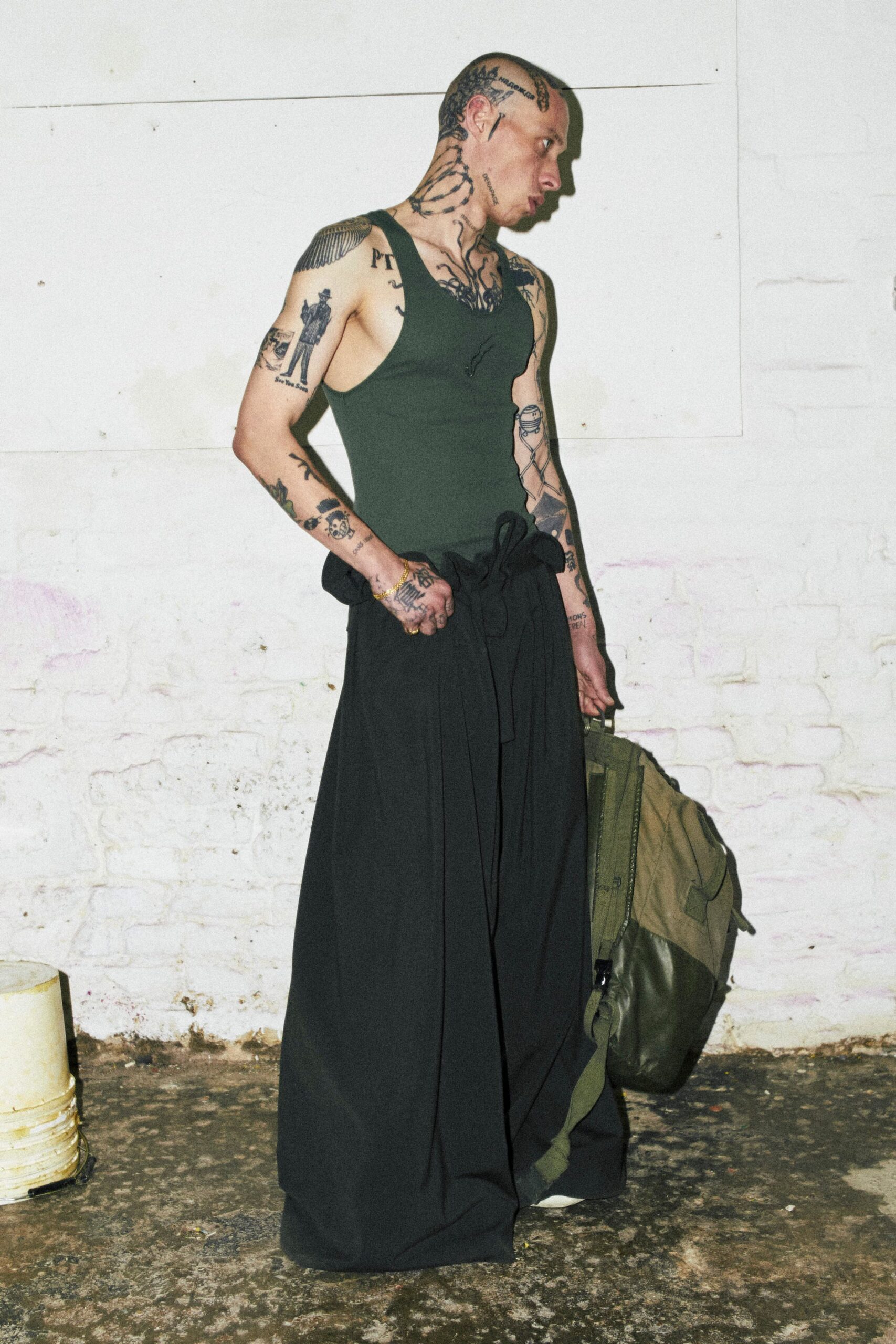 green tank-top black wide-leg pants