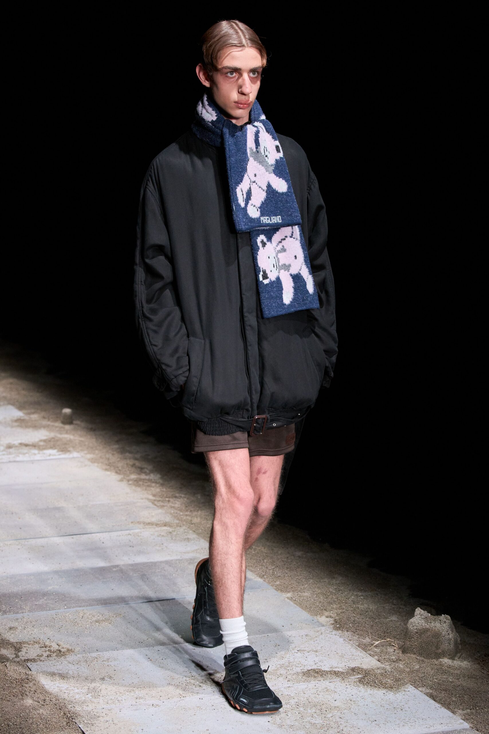 black oversized jacket with brown shorts