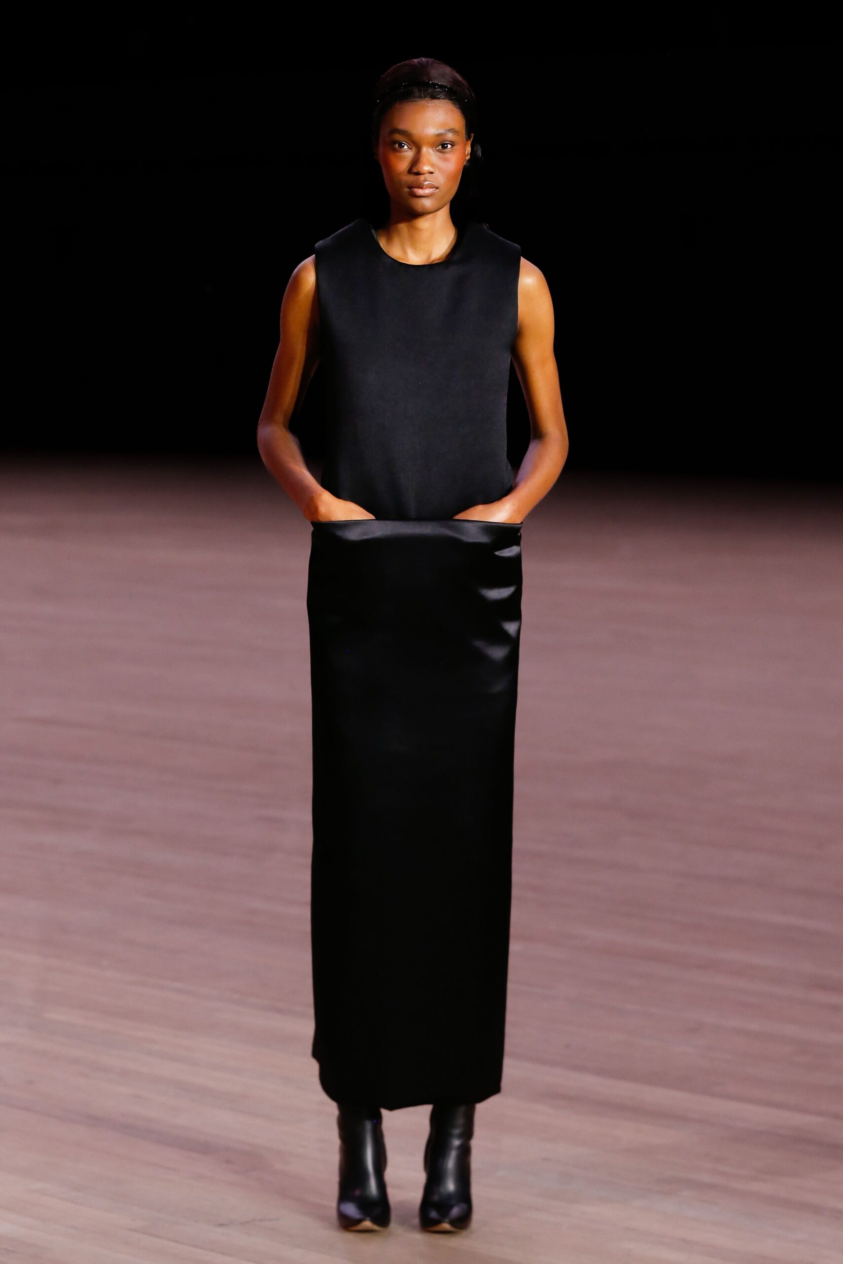 black silk sleeveless high-neck fitted straight-leg pockets dress