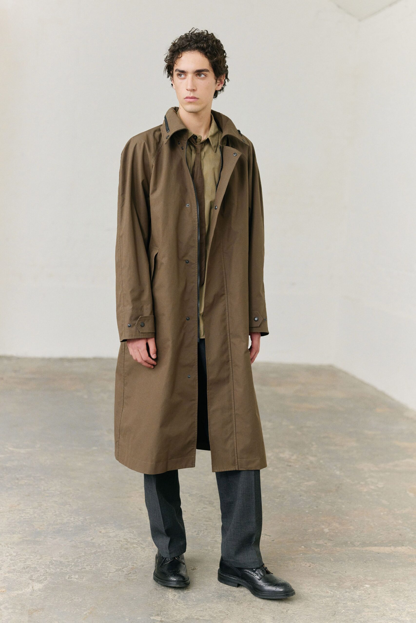 brown coat green shirt gray pants