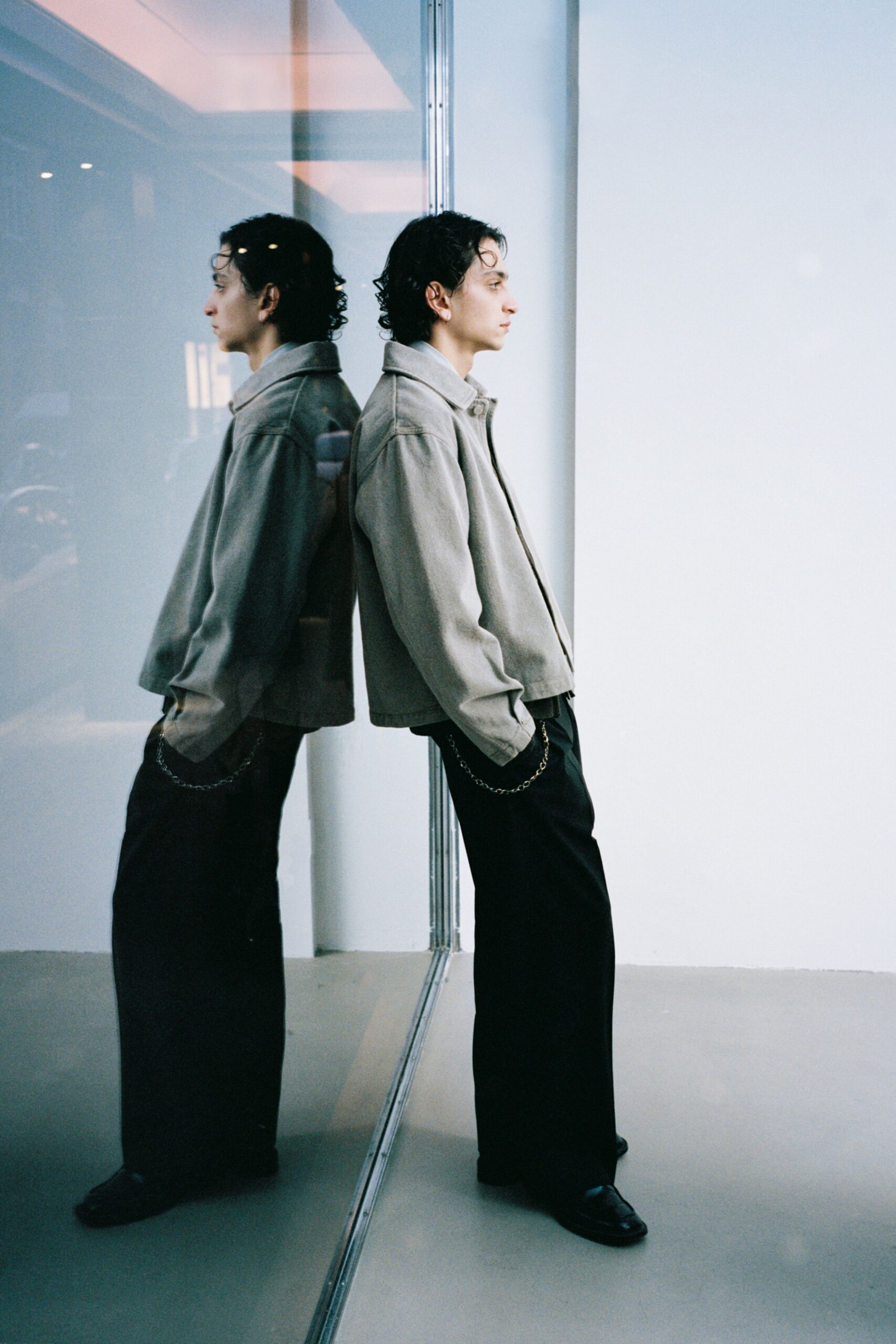 beige relaxed jacket black pants