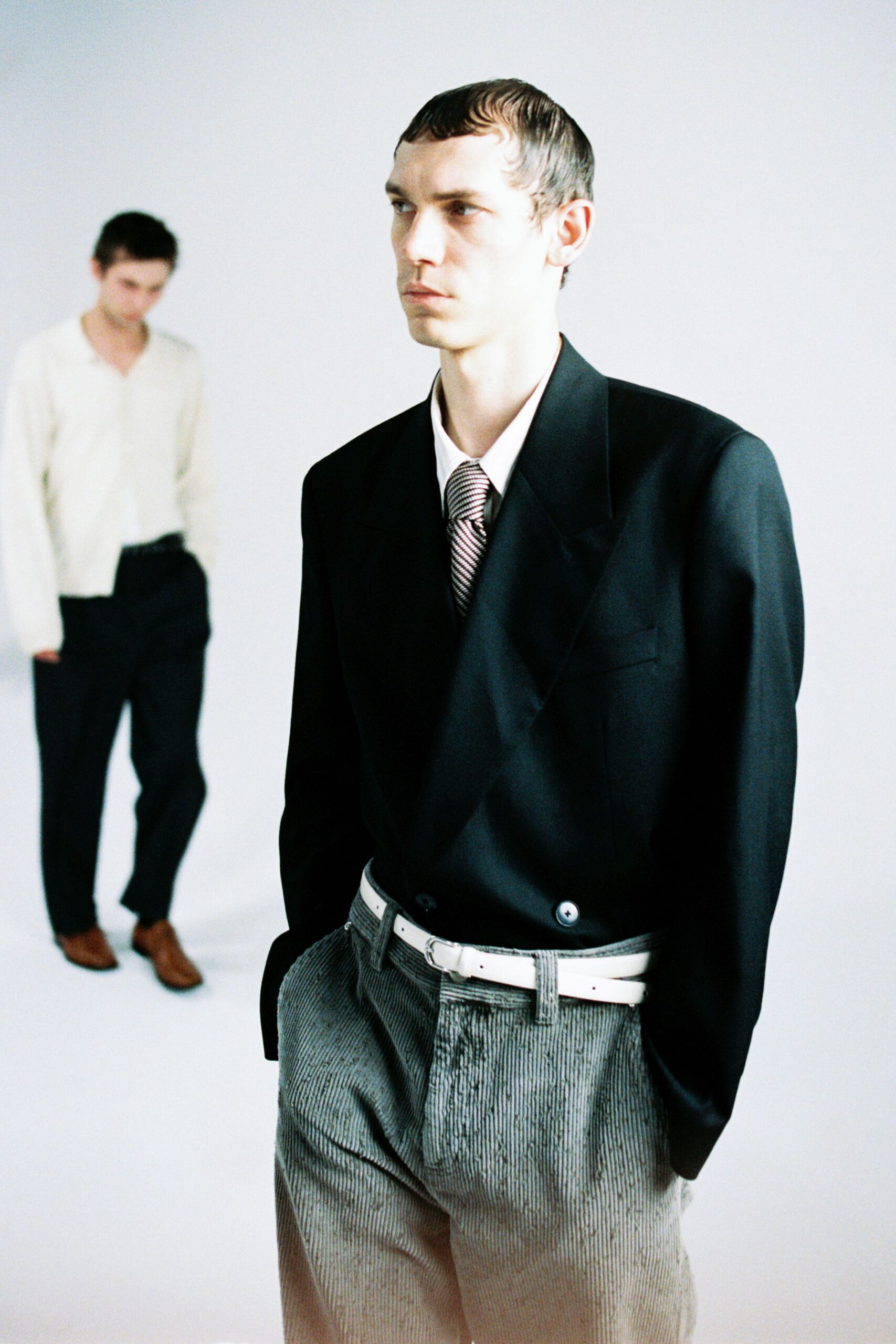 black blazer white shirt gray pants