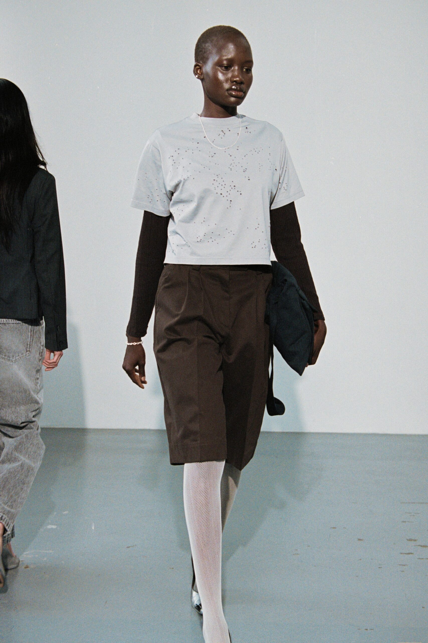 gray embellished top with brown pants