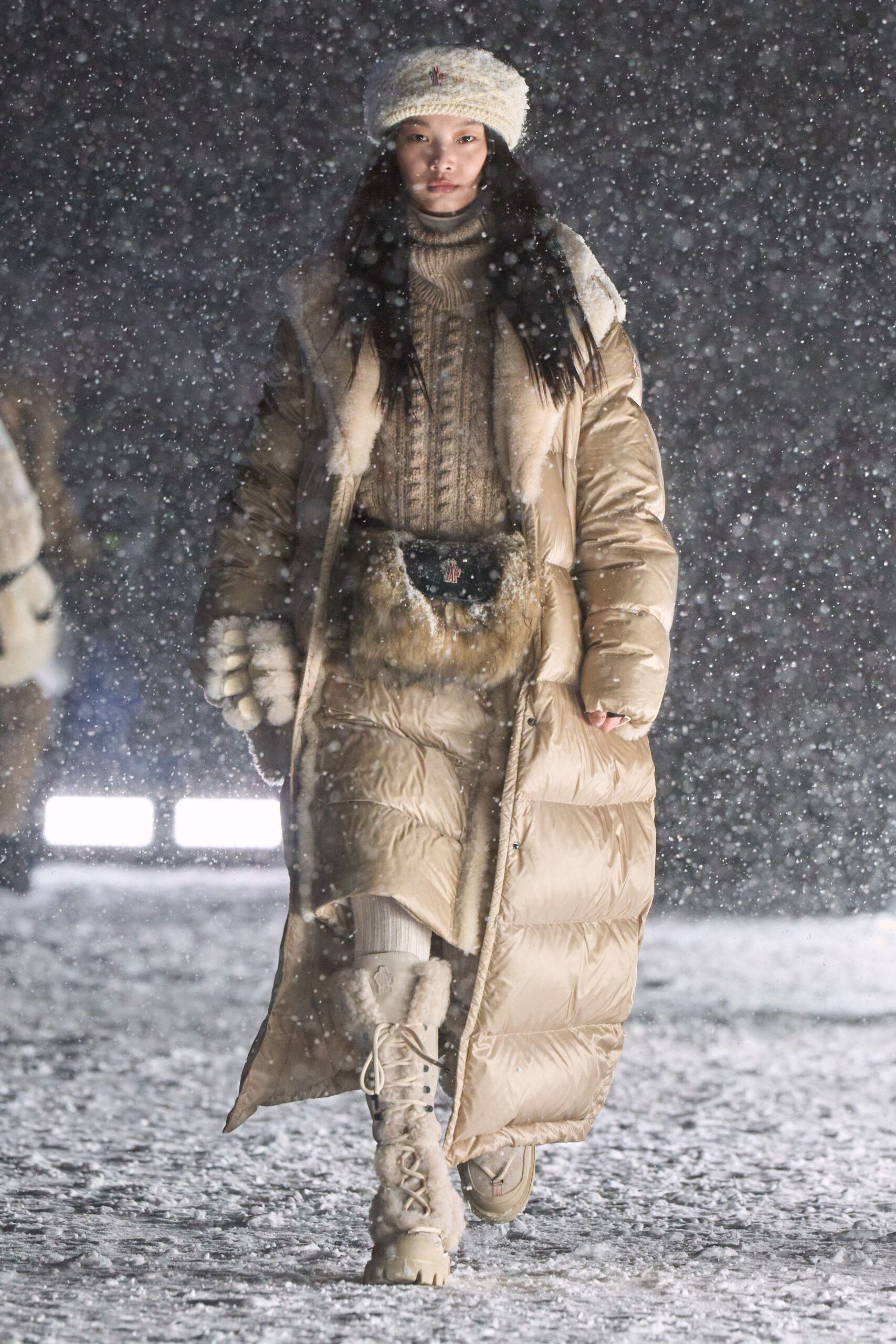 beige down coat with sweater