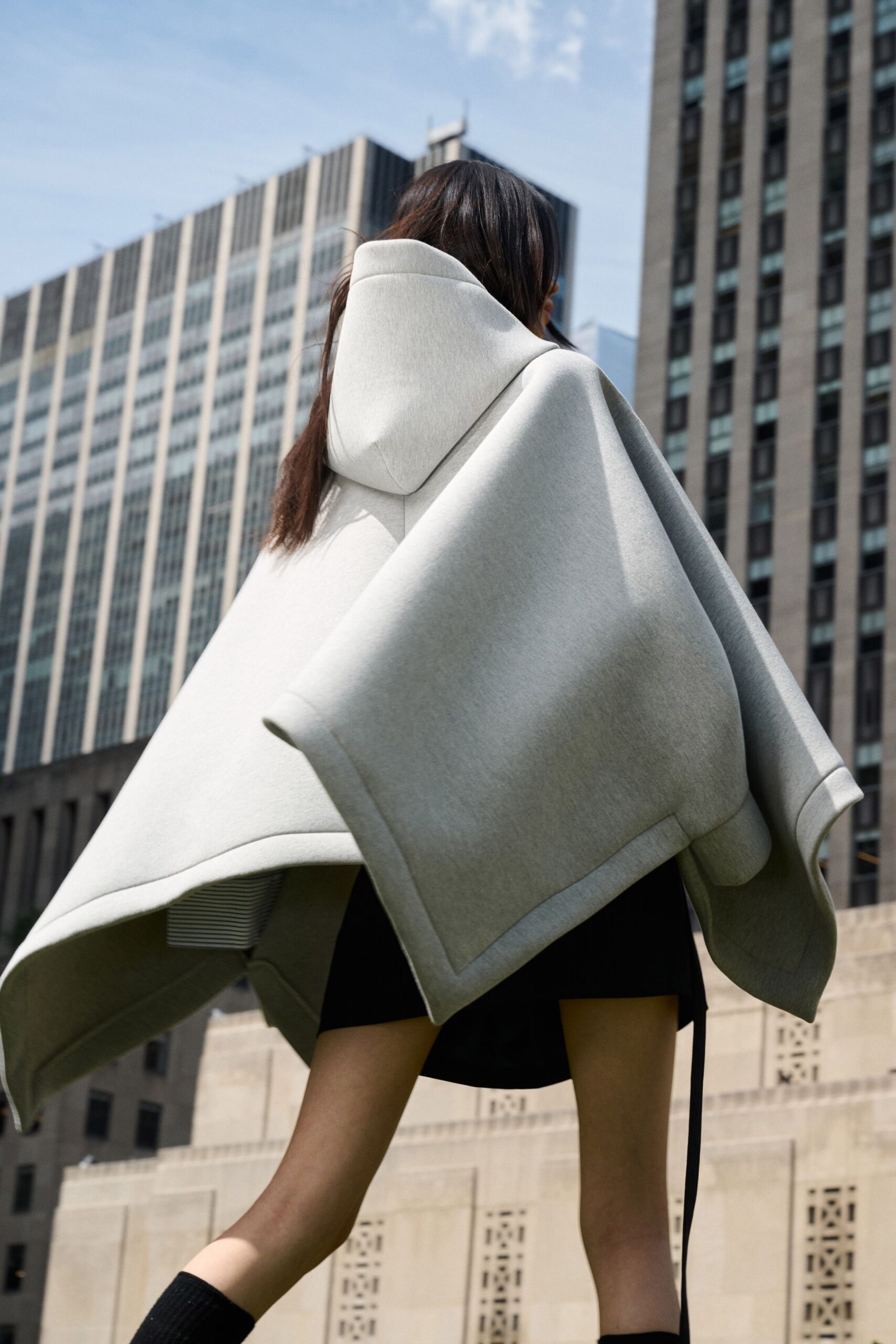 gray oversized poncho with black dress