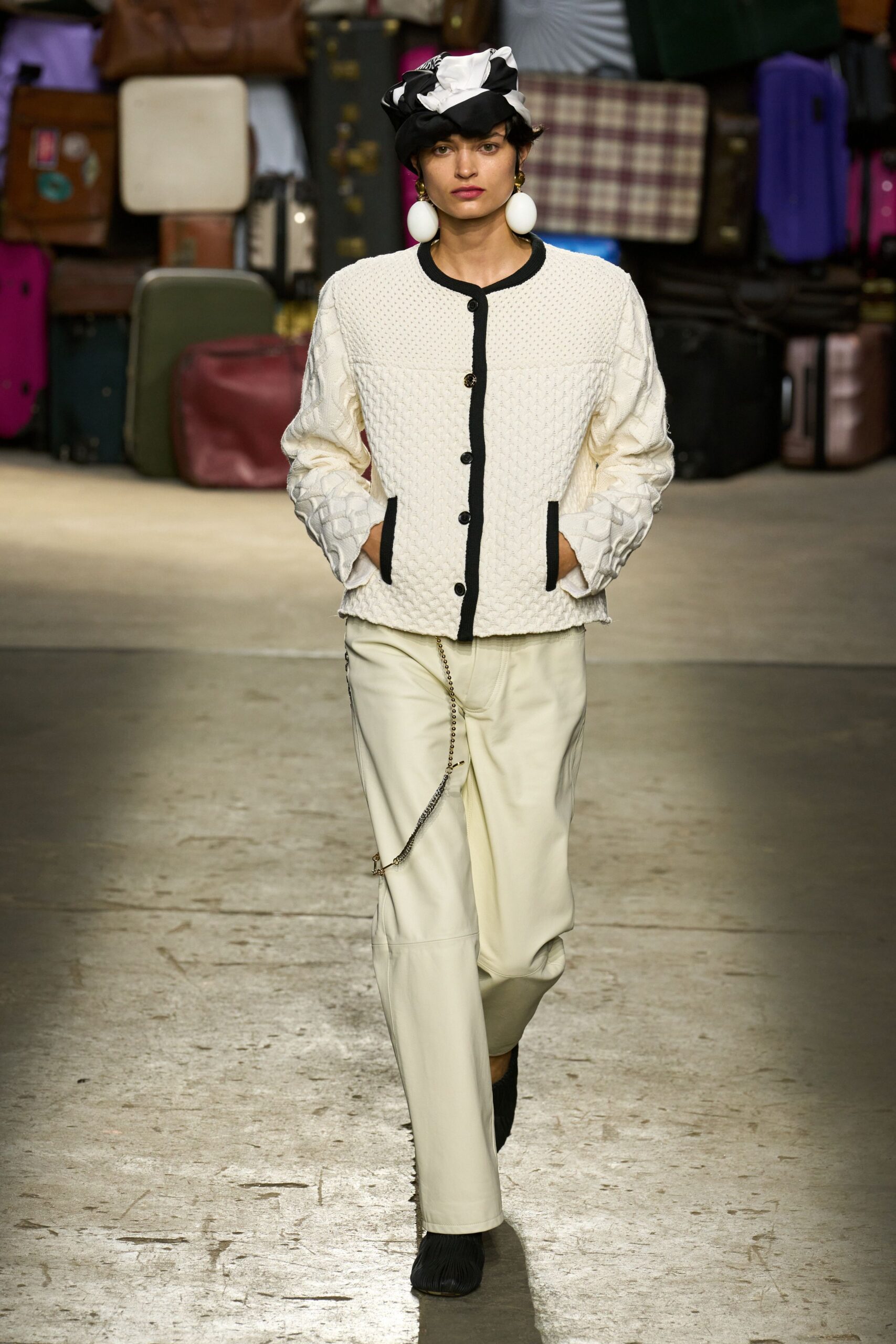 white fitted jacket beige pants