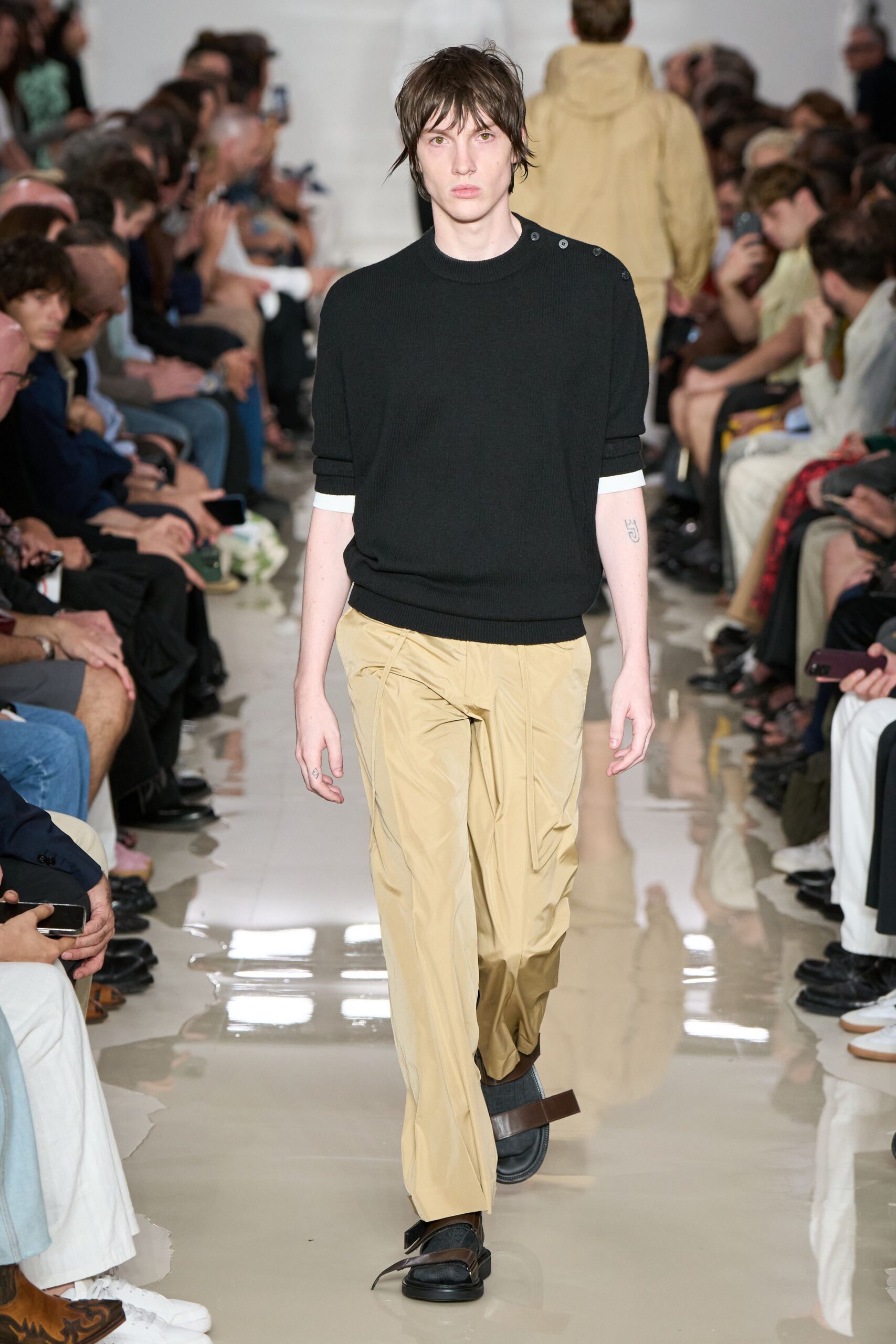 black relaxed sweater with beige cargo pants