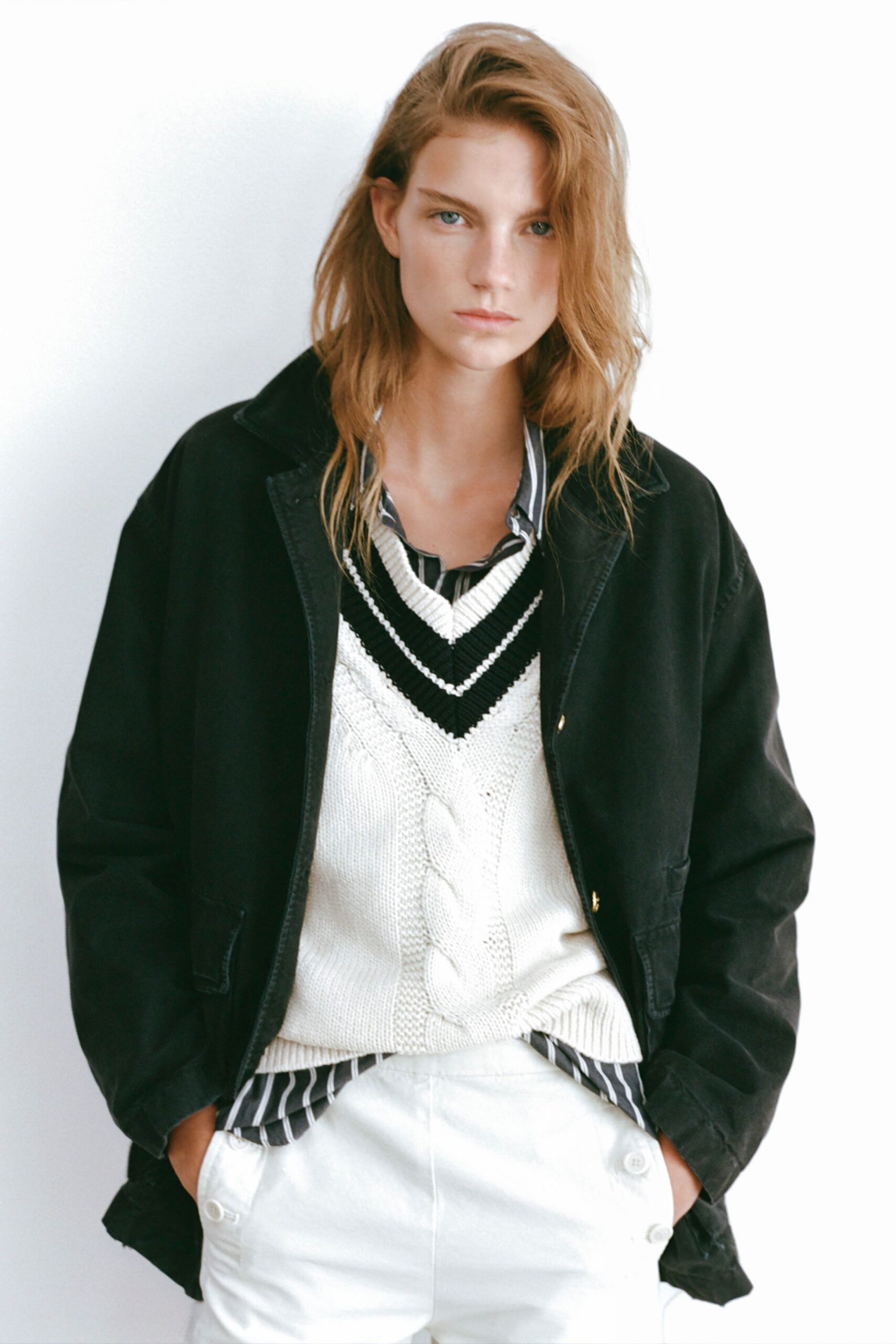 relaxed black jacket with white sweater