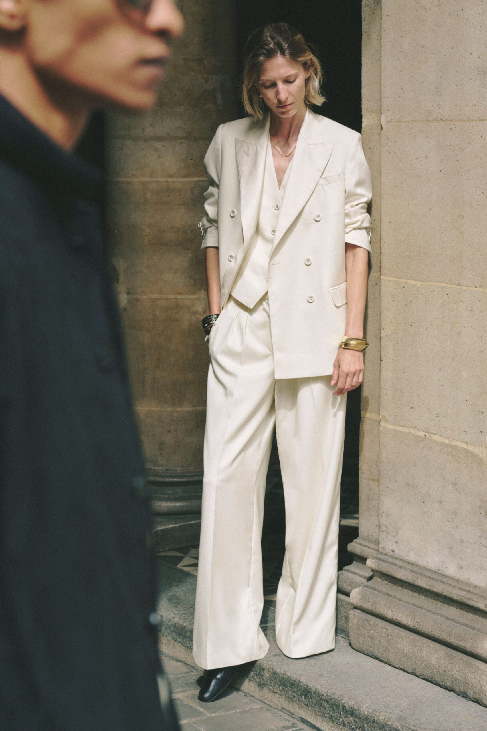 white tailored suit with black shoes