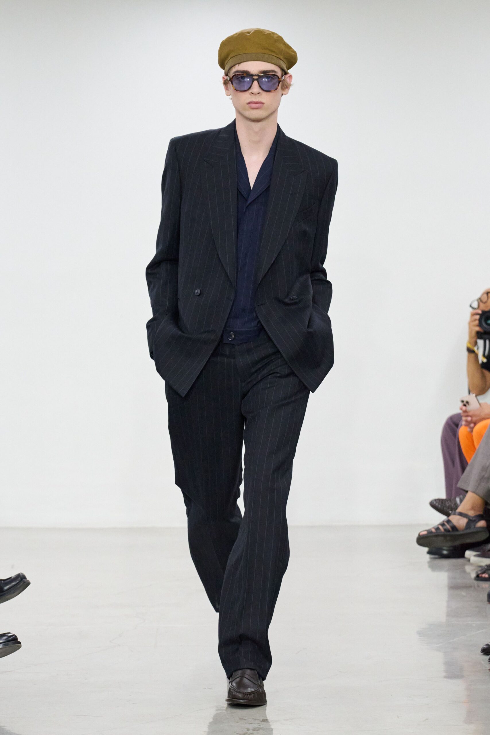 black striped suit with blue shirt