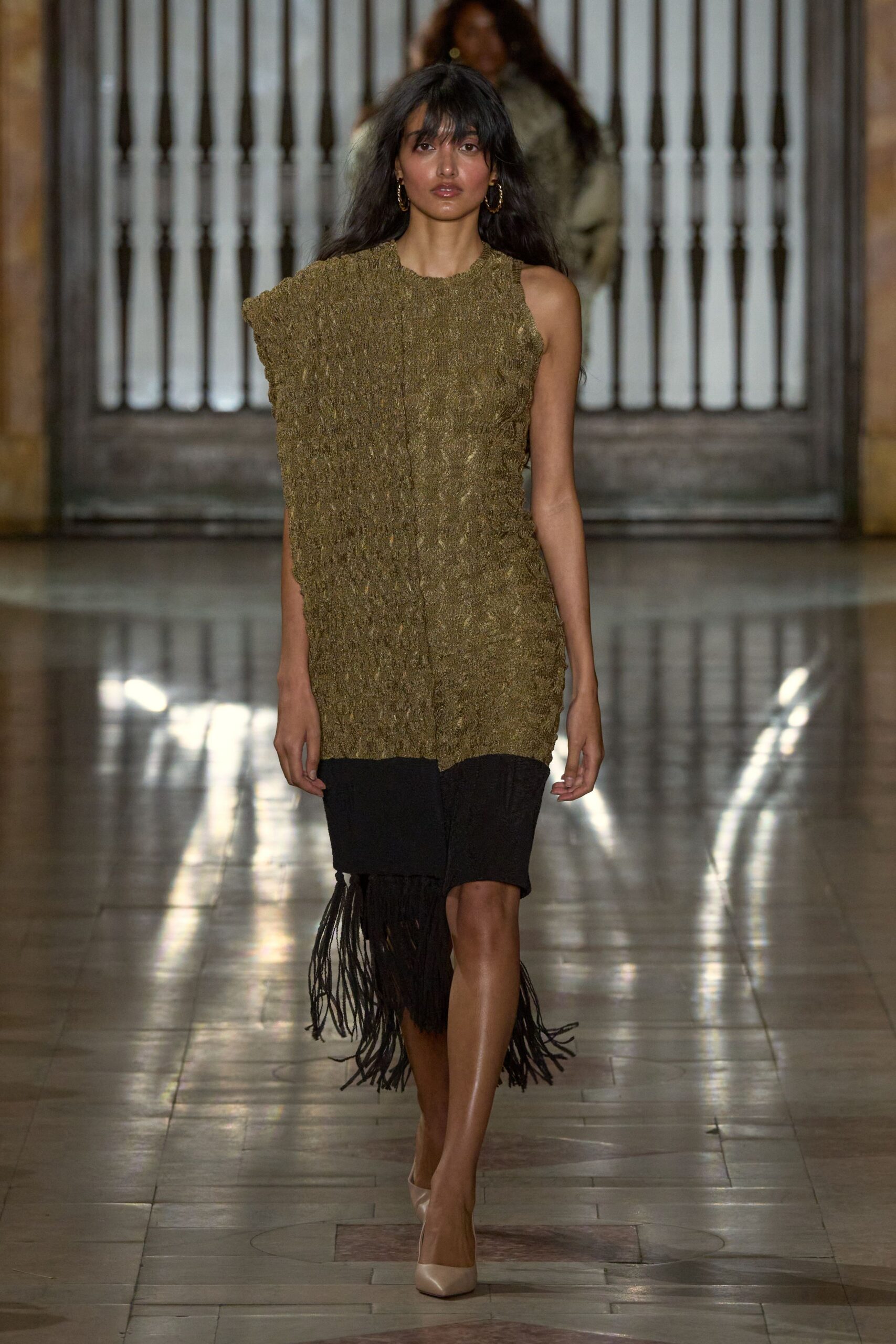 asymmetric green and black dress with fringes