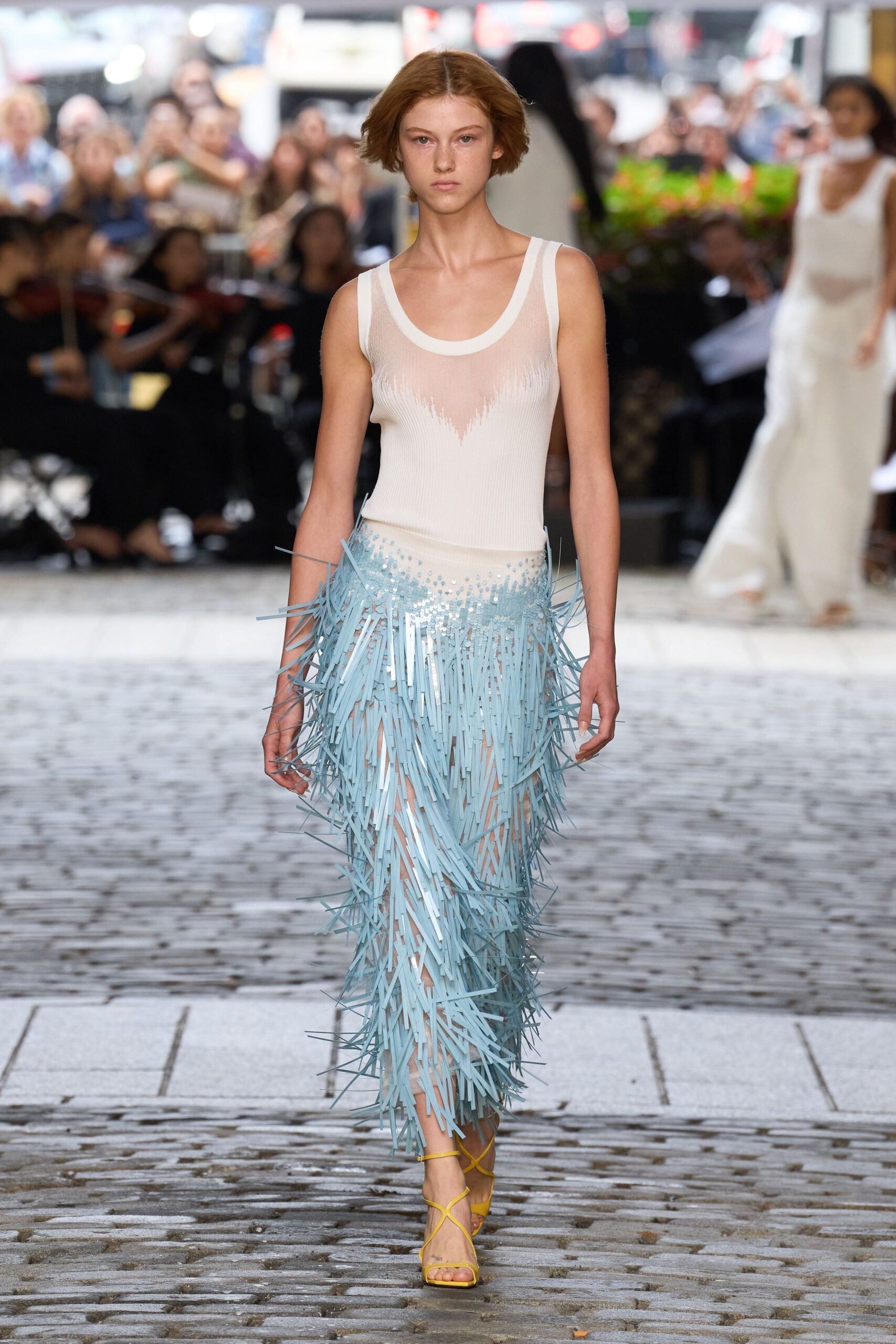 white and blue fringed dress with yellow shoes