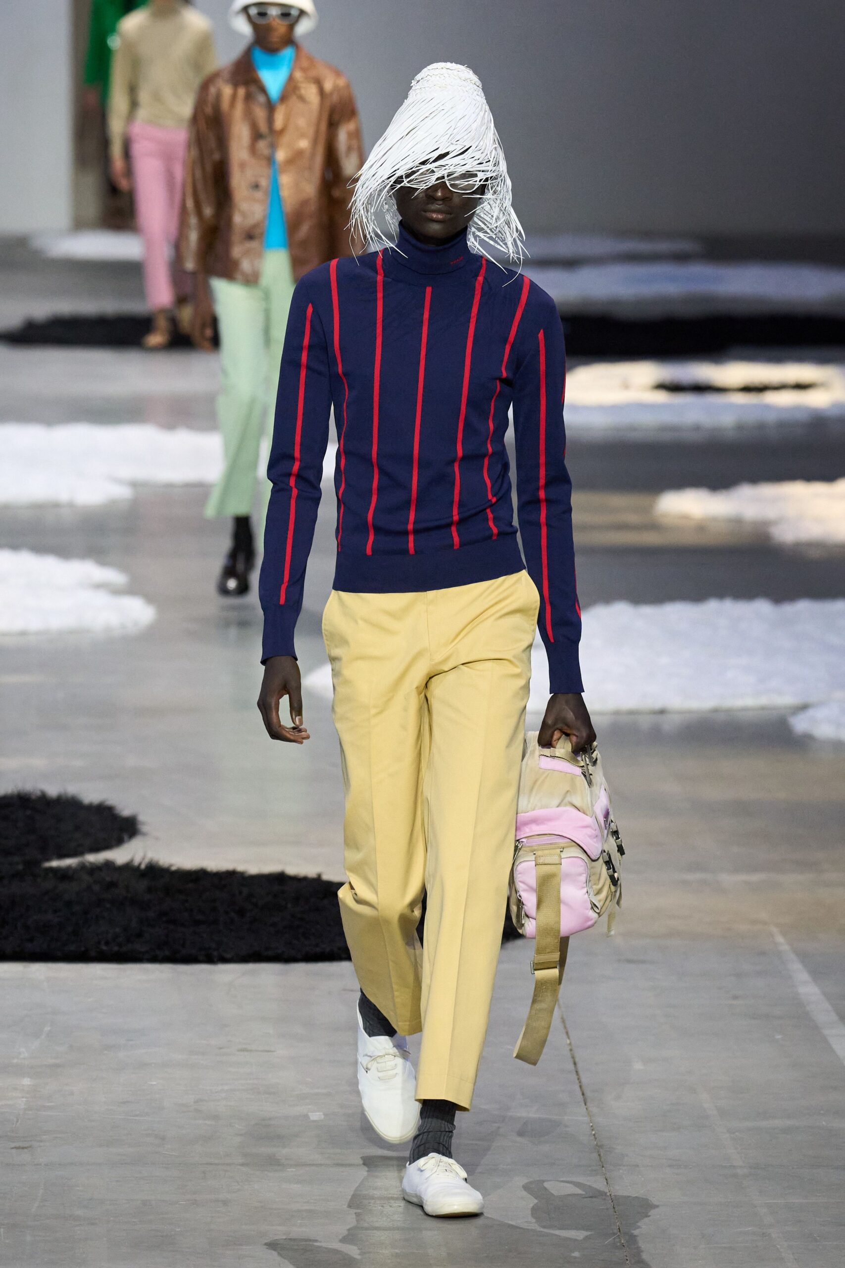 navy striped fitted sweater with yellow pants