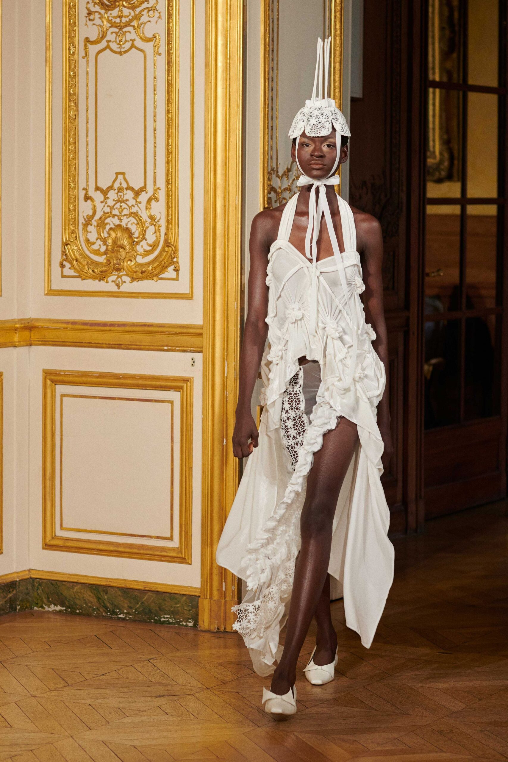 white silk sleeveless high-neck fitted ruffled layered gown
