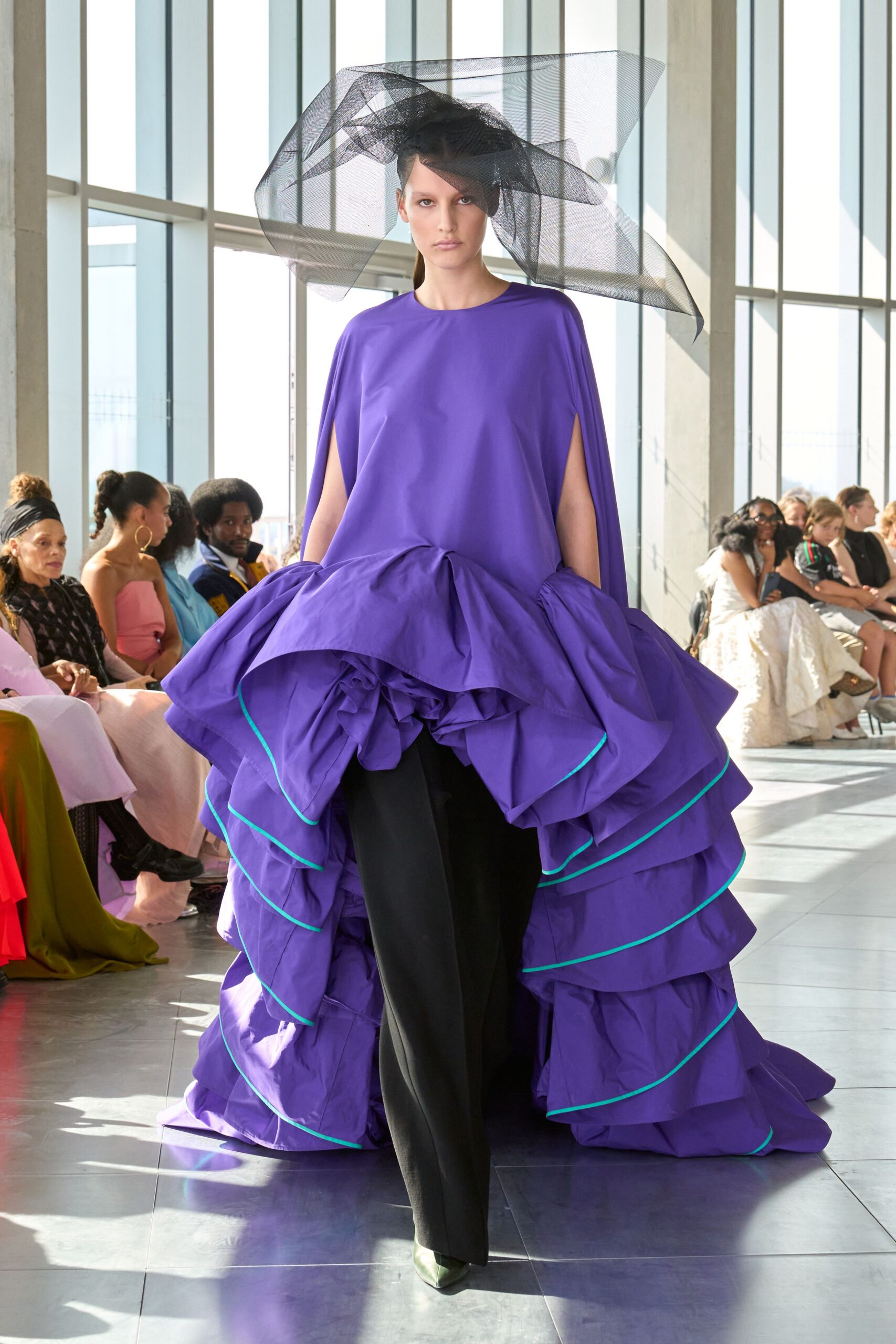 purple tiered gown with black pants