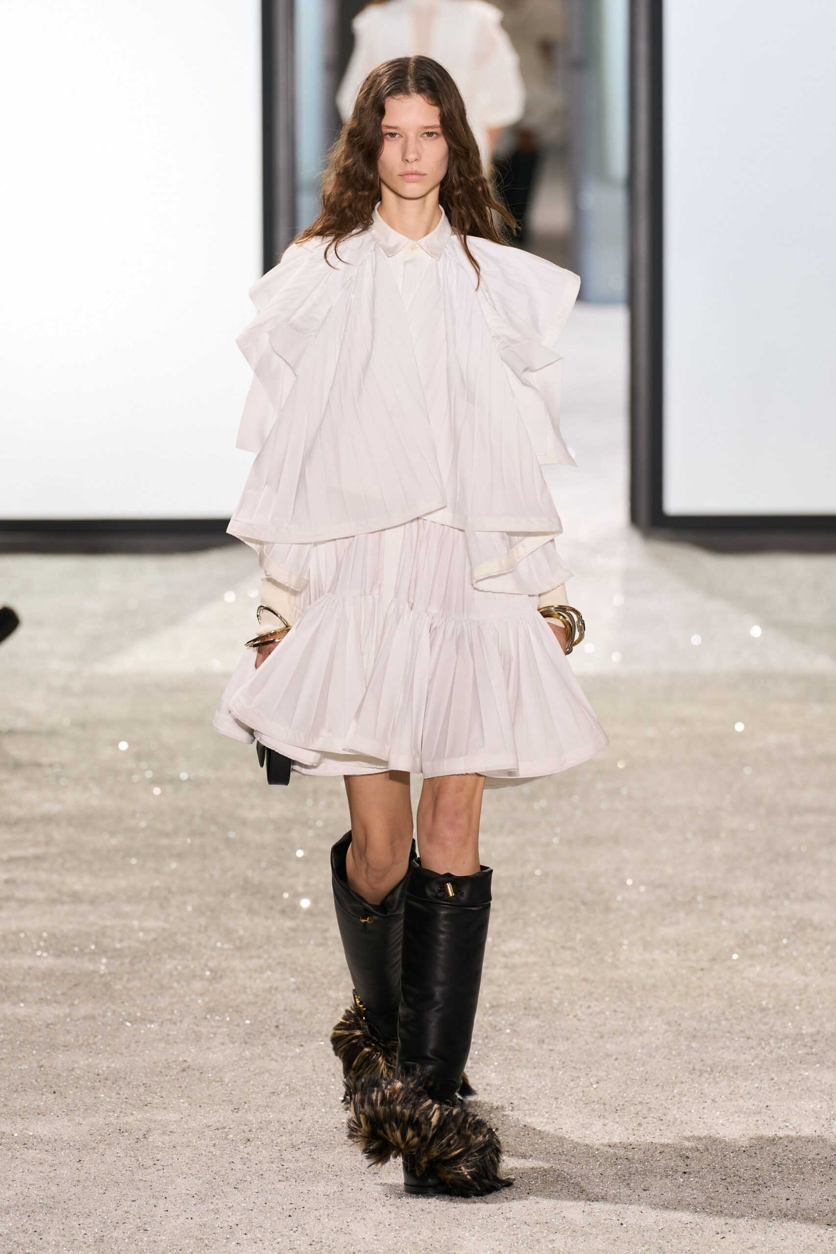 white ruffled mini dress with black boots