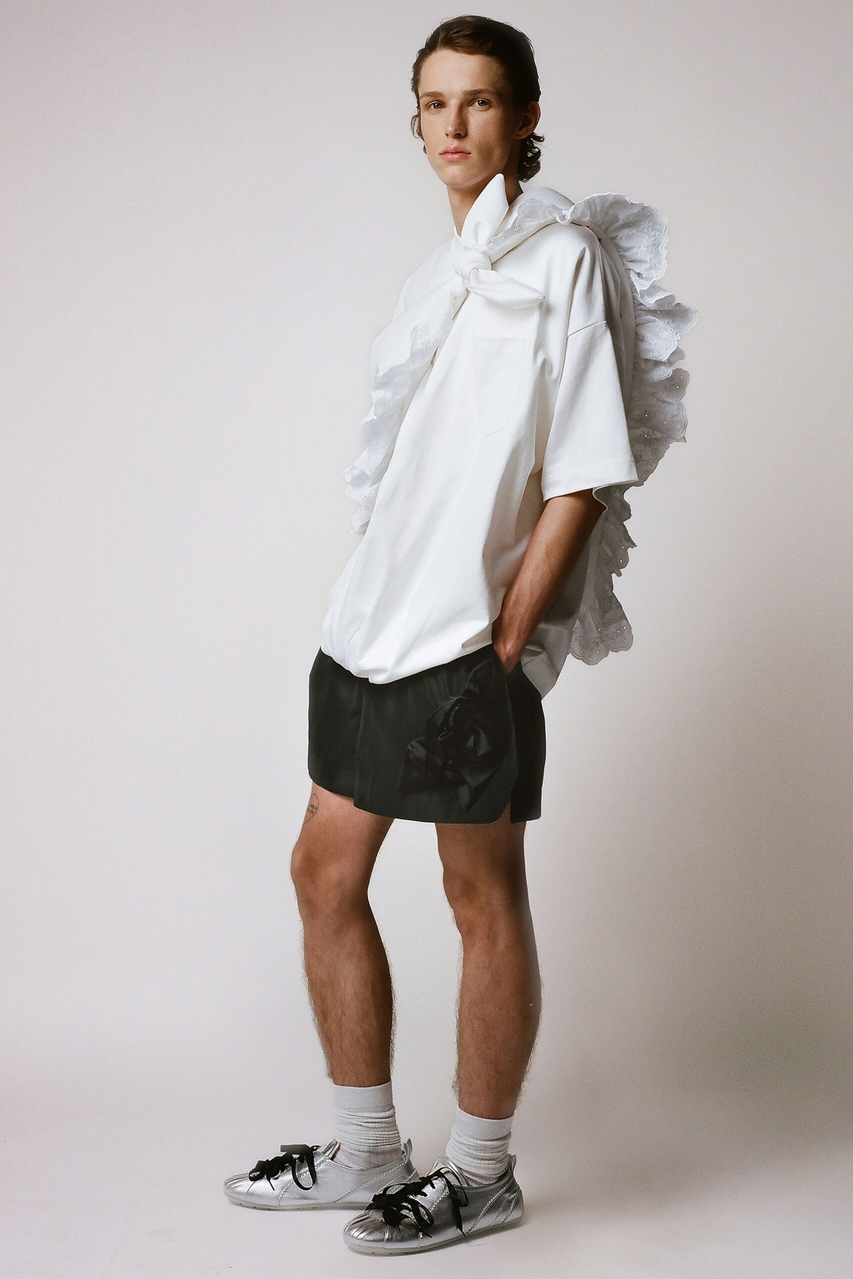 white relaxed shirt black shorts