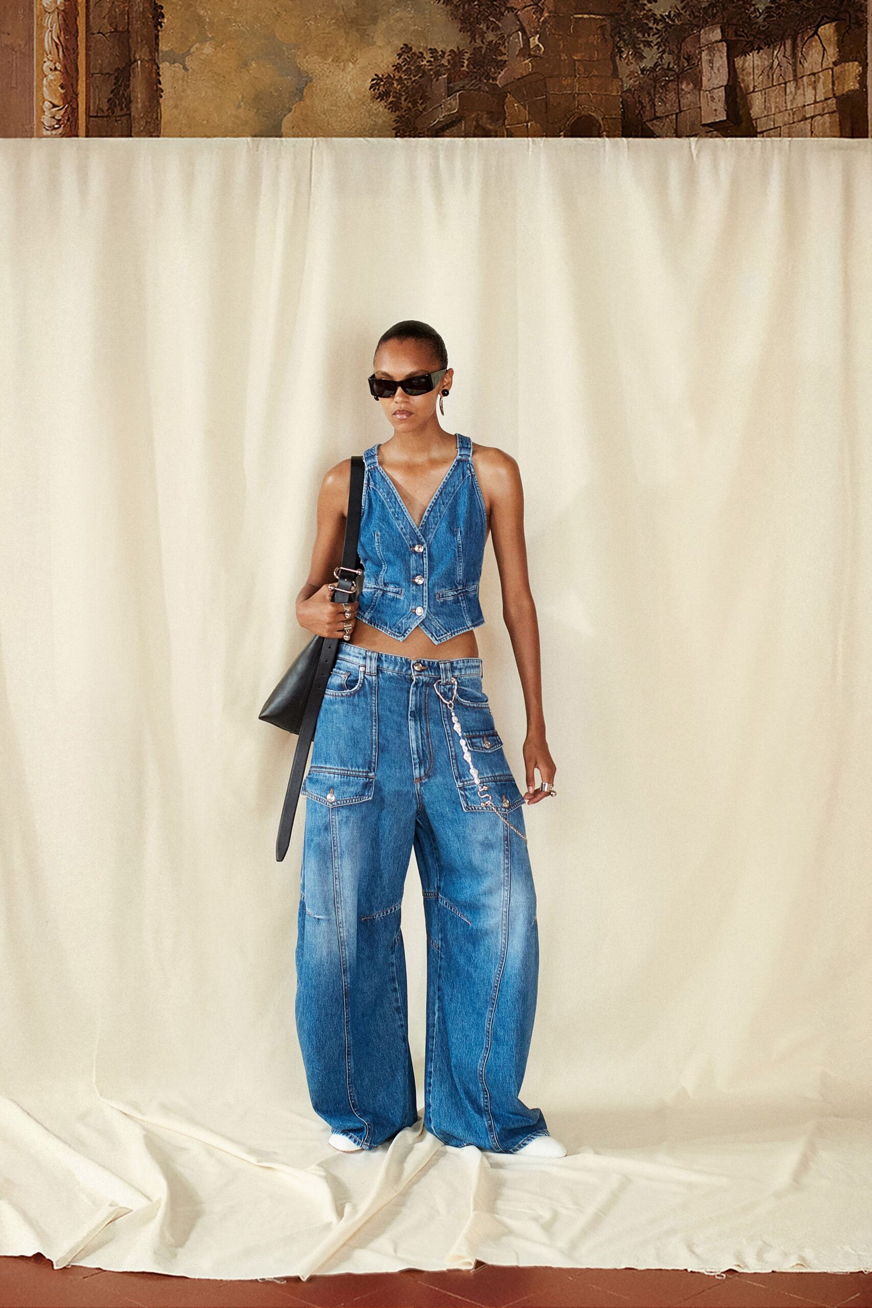 blue denim sleeveless v-neck fitted buttoned pockets top