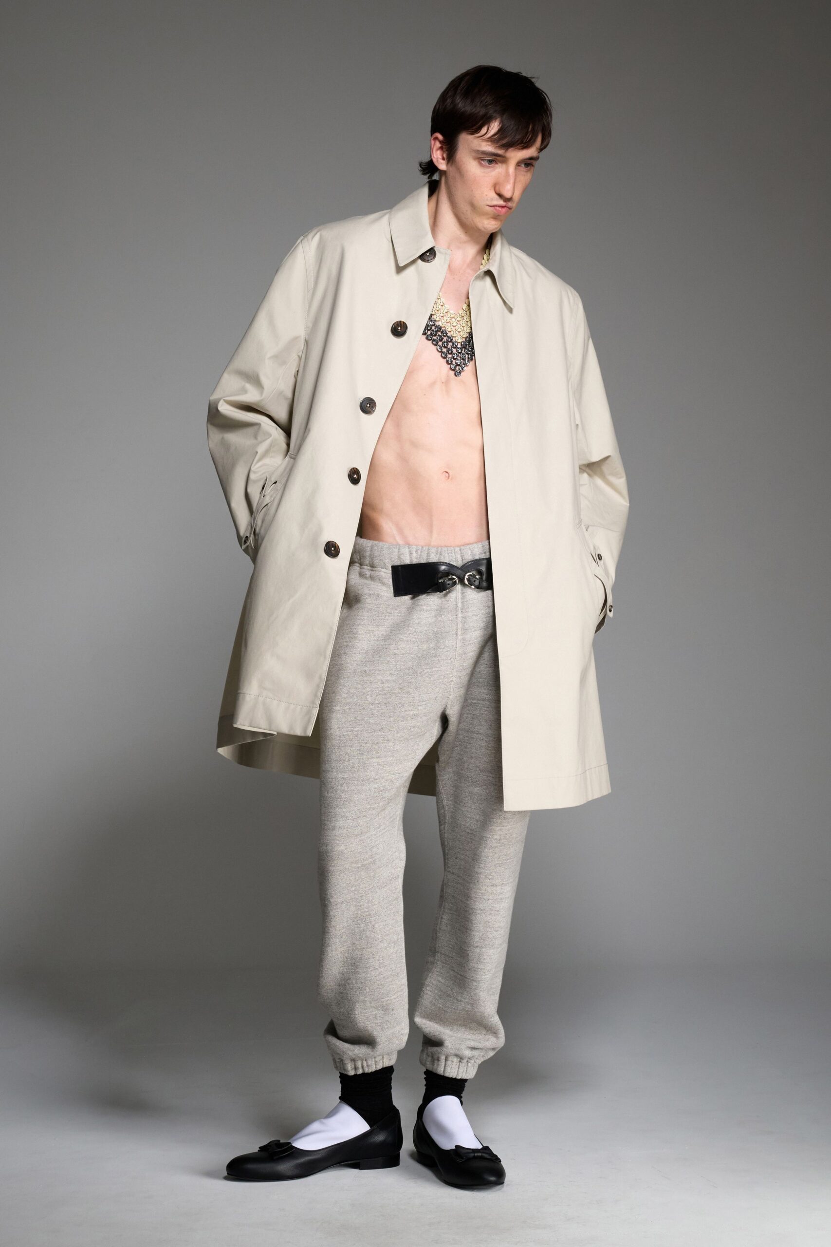 beige coat gray pants black shoes