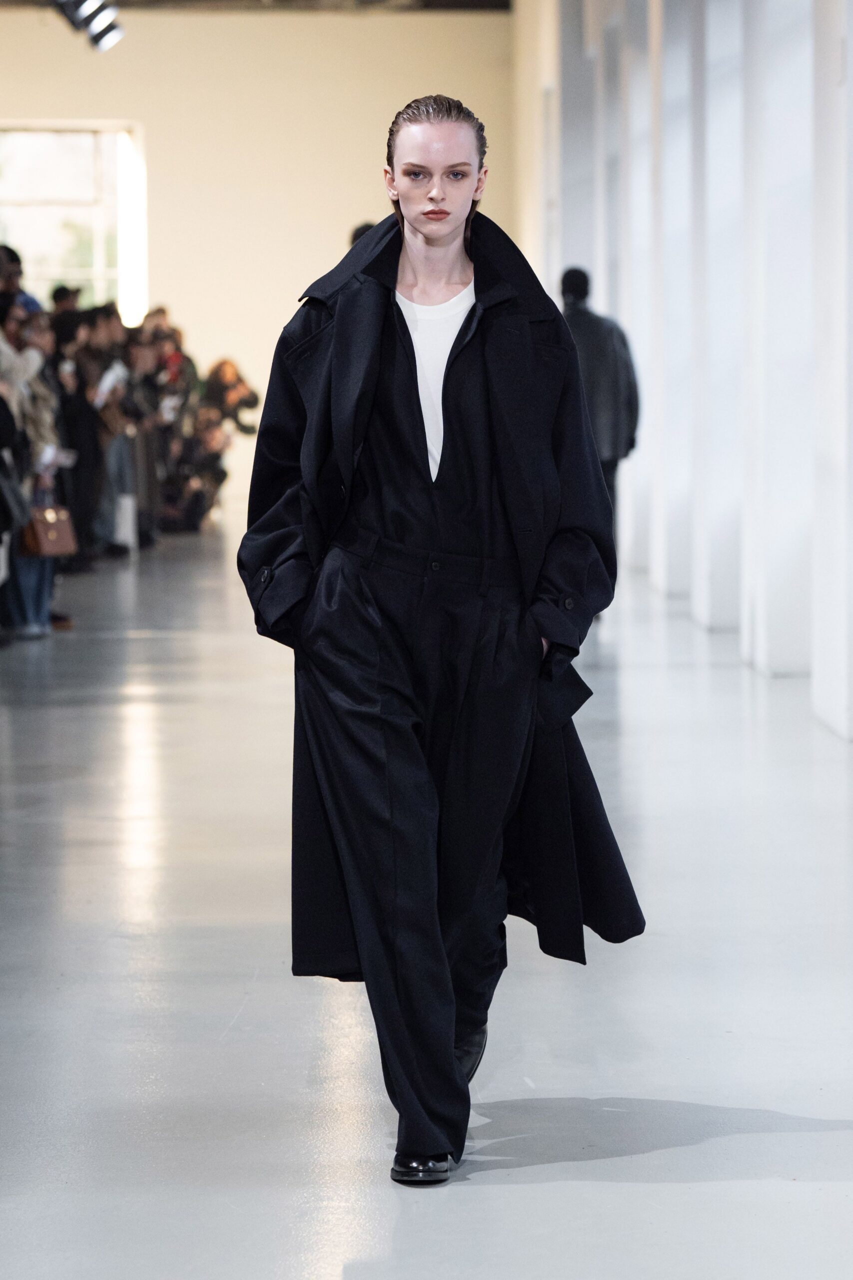 black oversized coat white top