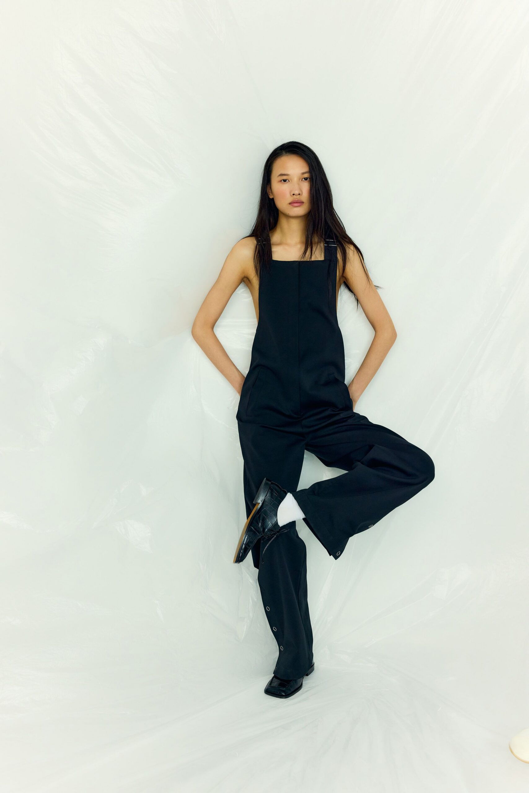 black sleeveless jumpsuit with shoes