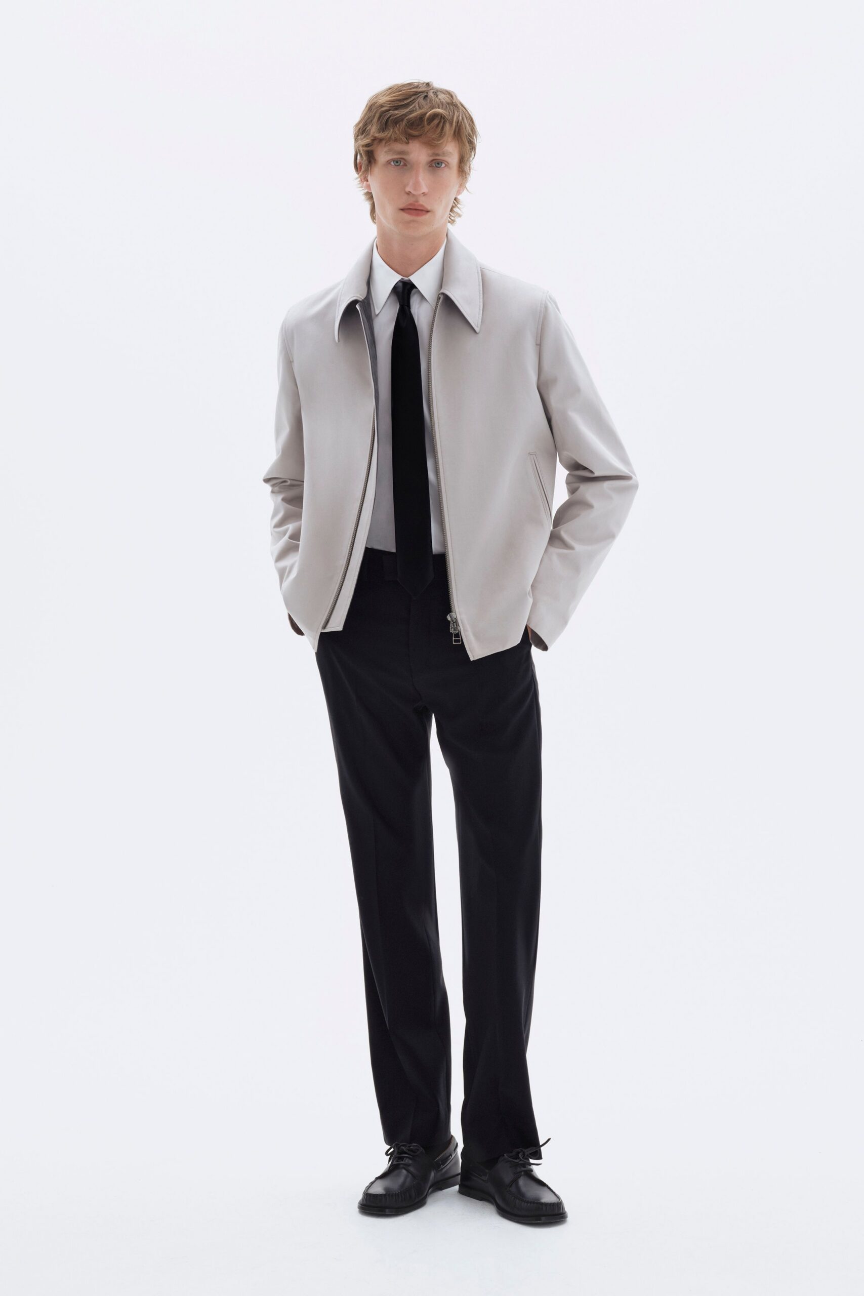 gray leather jacket with black pants