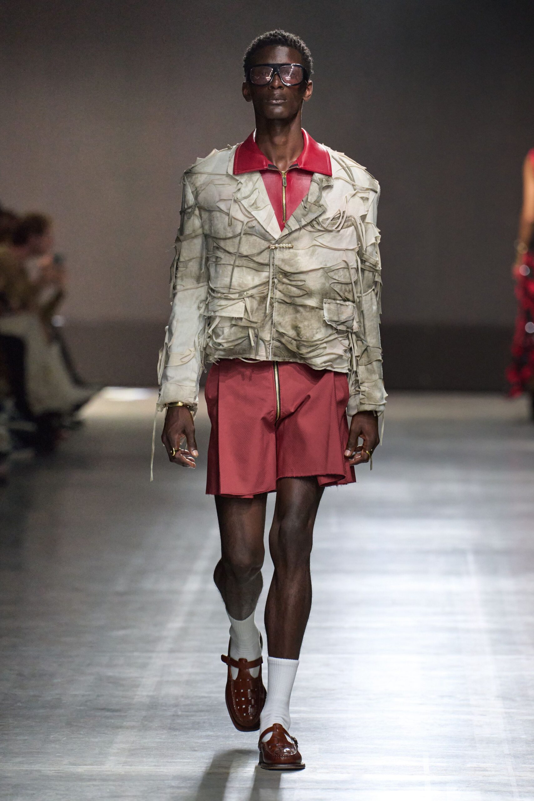 relaxed white jacket with red shorts