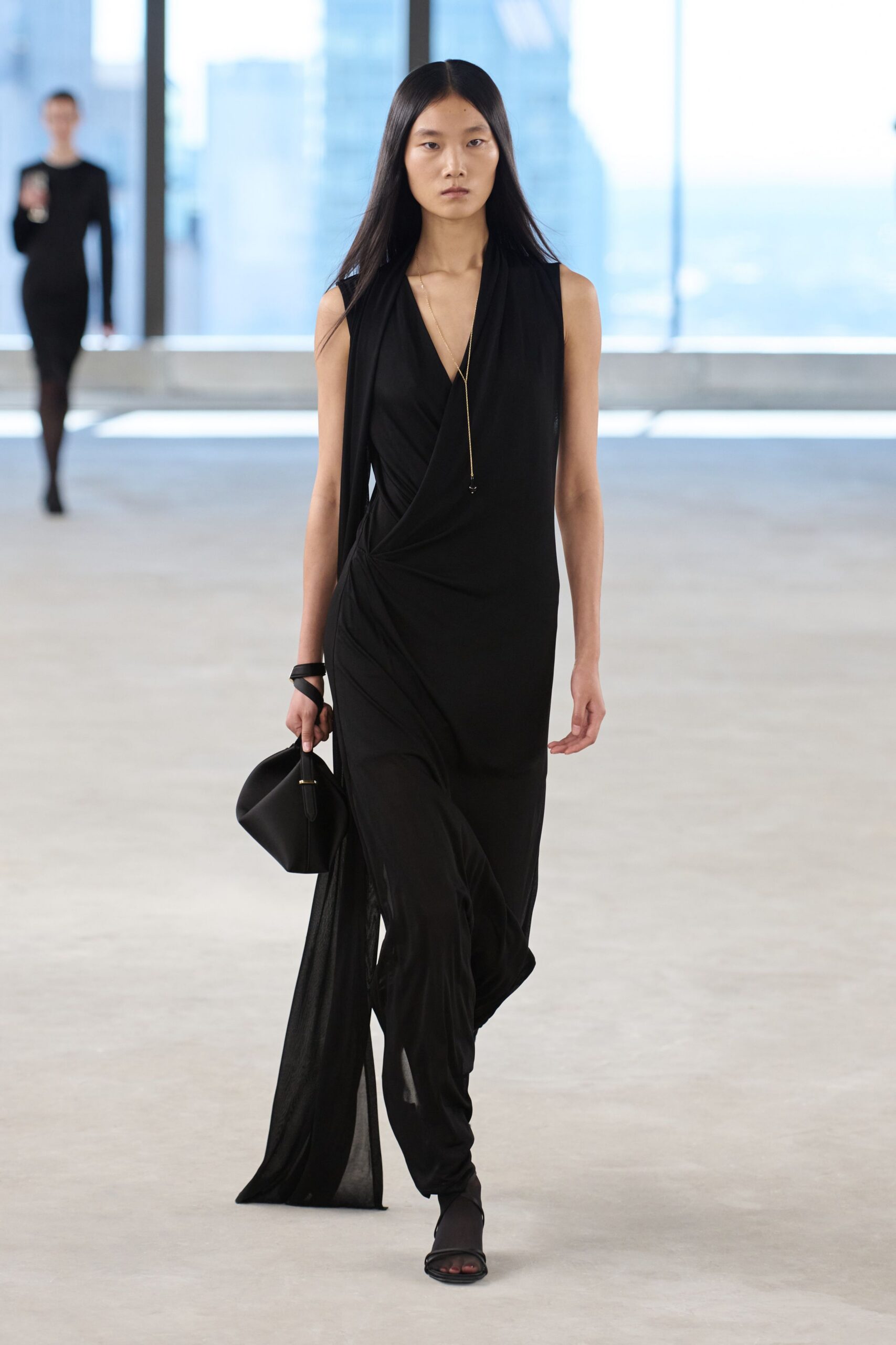 black fitted sleeveless wrap dress