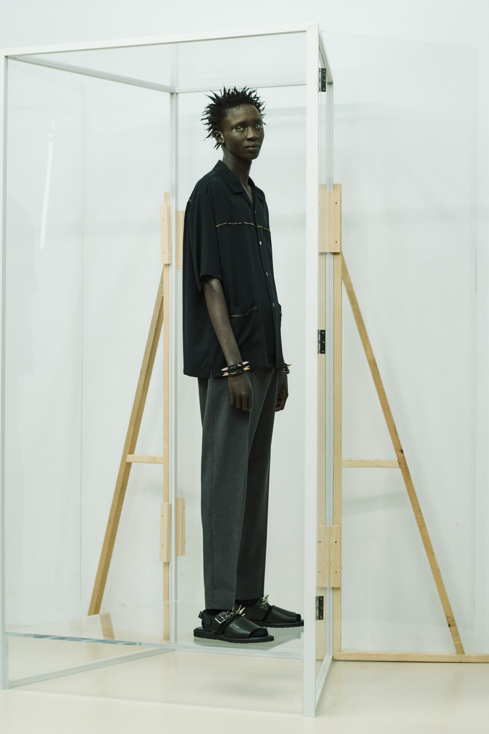 black relaxed shirt gray tailored pants