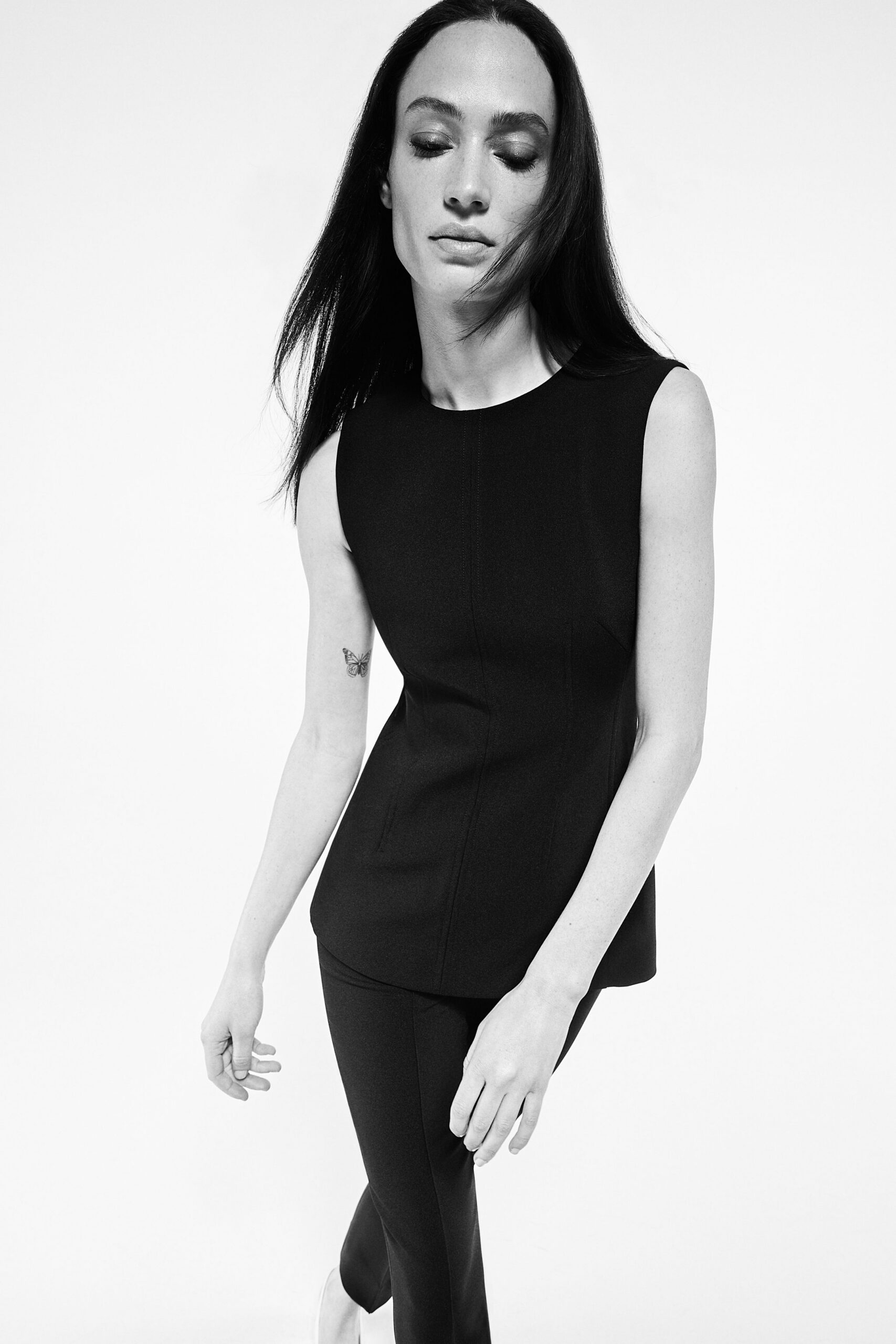 black cotton sleeveless high-neck fitted top
