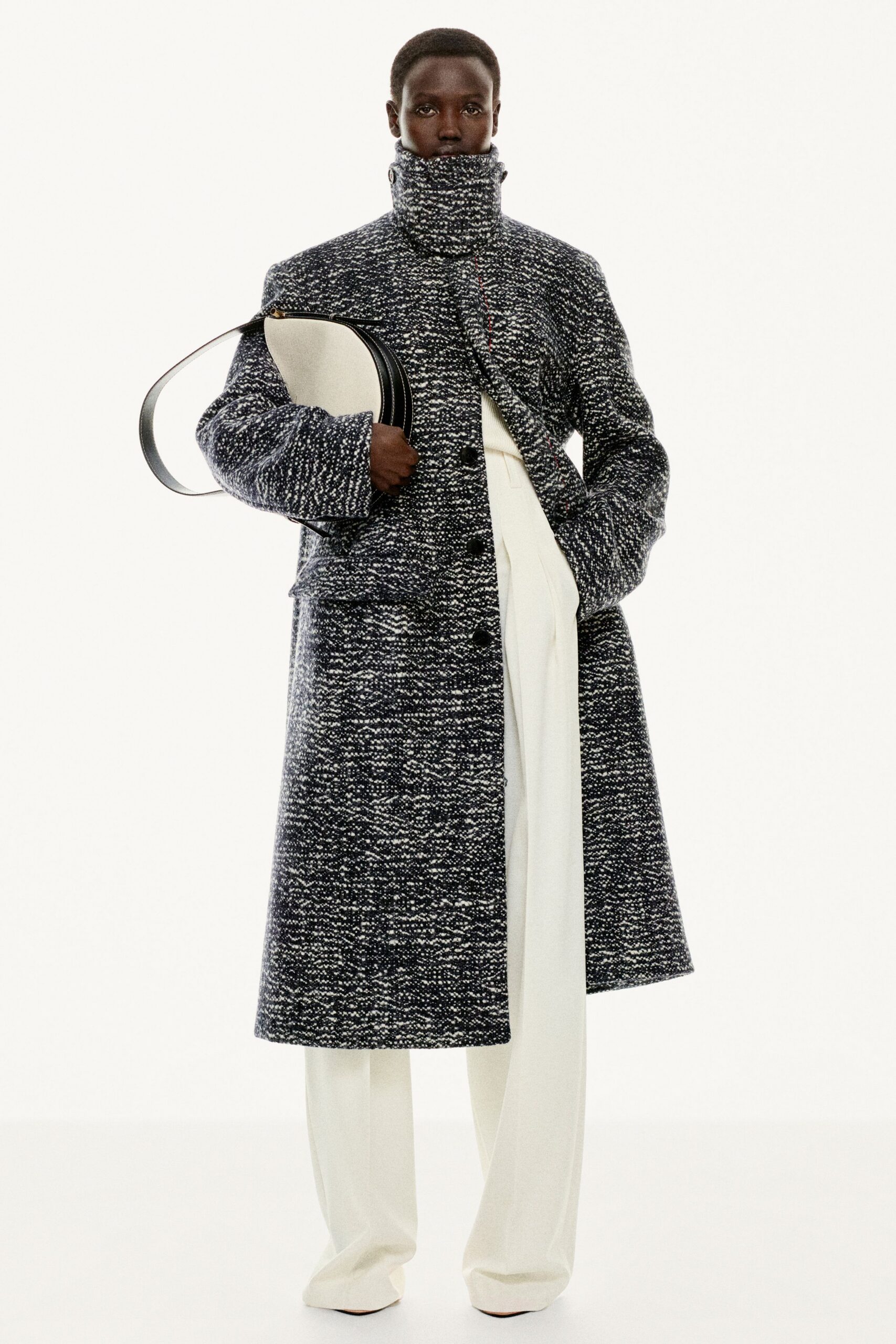 black wool long-sleeve collared relaxed buttoned layered coat