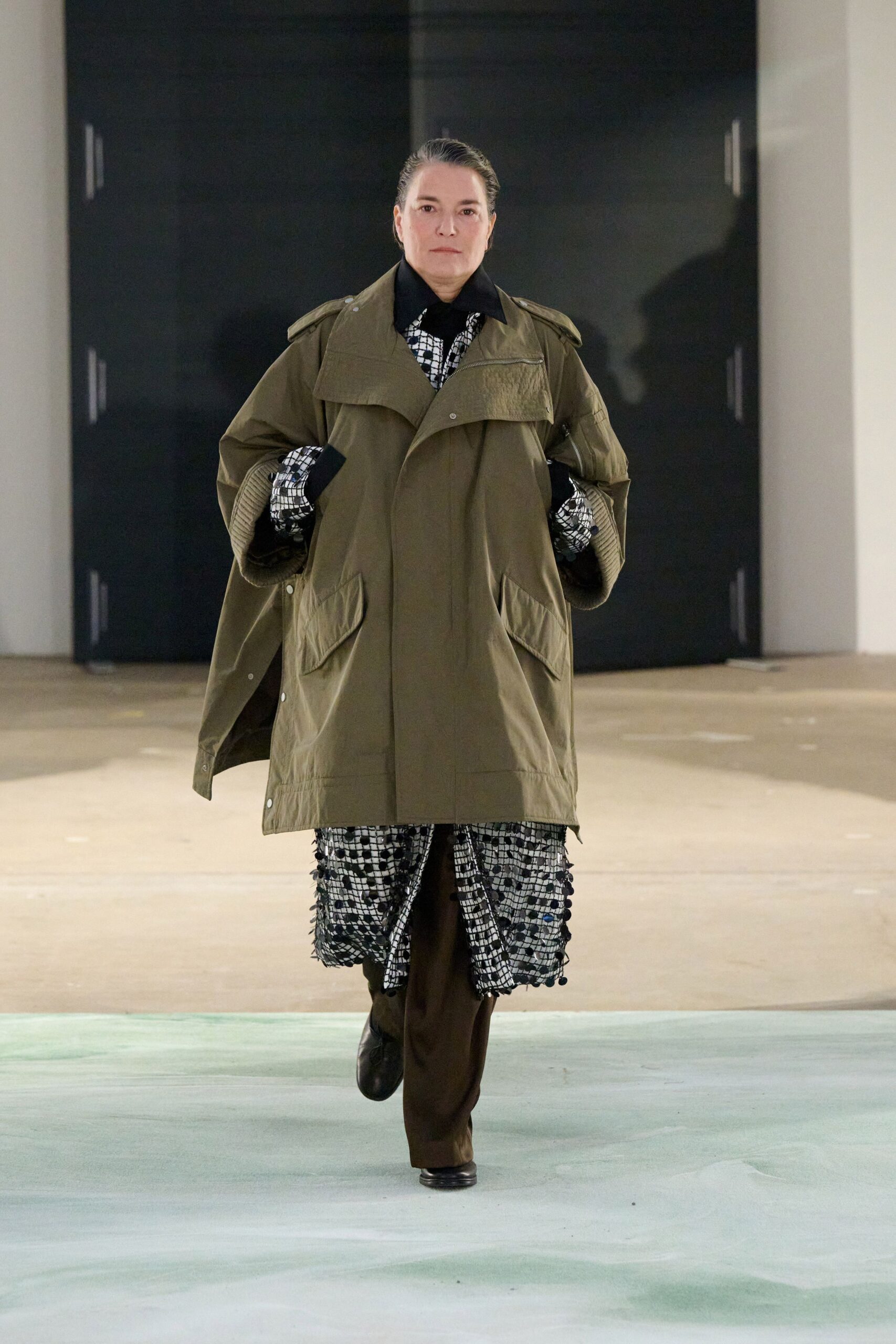 green coat with checked dress